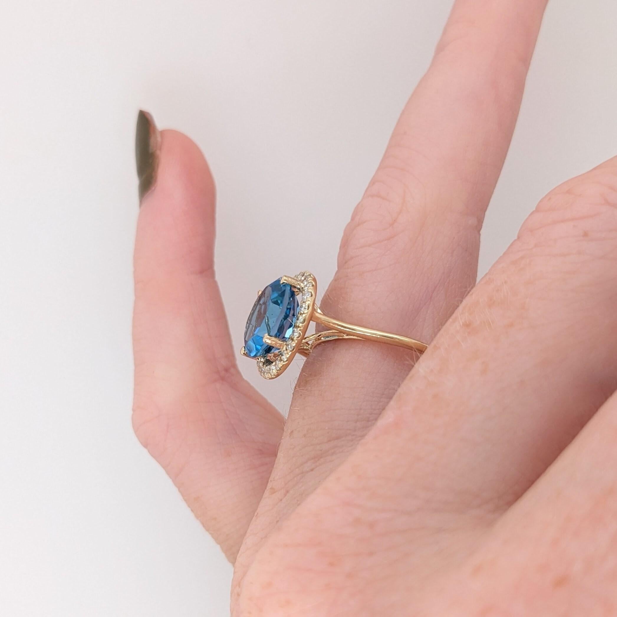 Get swept away with this gorgeous Swiss blue topaz ring with a dazzling diamond halo.  We love this simple halo ring design paired with a large carat stone! A gorgeous modern look that's perfectly balanced between minimalist and glamour!

Topaz is a