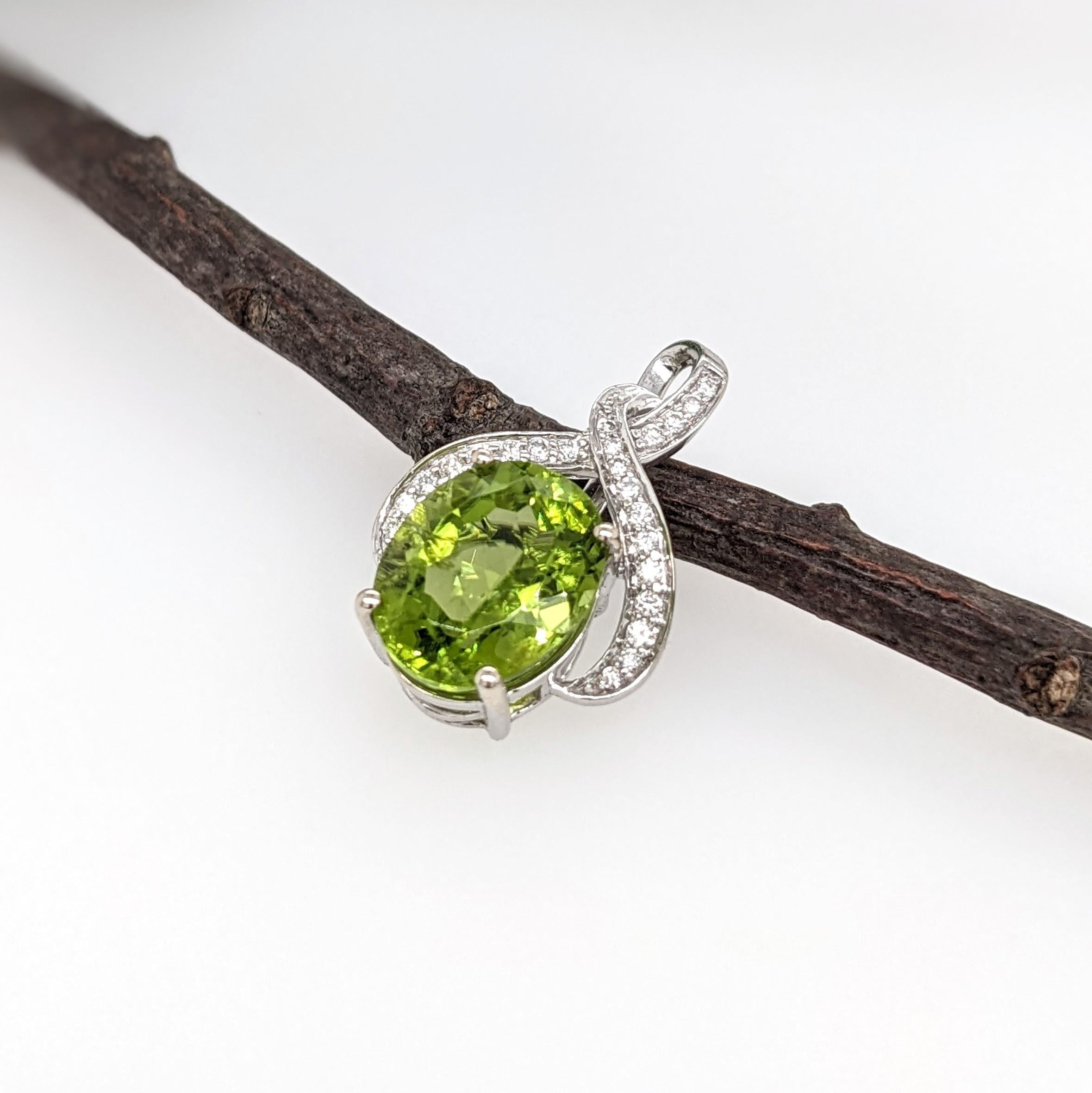 This eye-catching infinity pendant features a breathtaking oval 4.45 carat peridot with natural earth-mined diamonds. Set in solid 14K yellow gold, this piece is sure to be a favorite in your collection! 

Specifications

Item Type: Pendant
Center