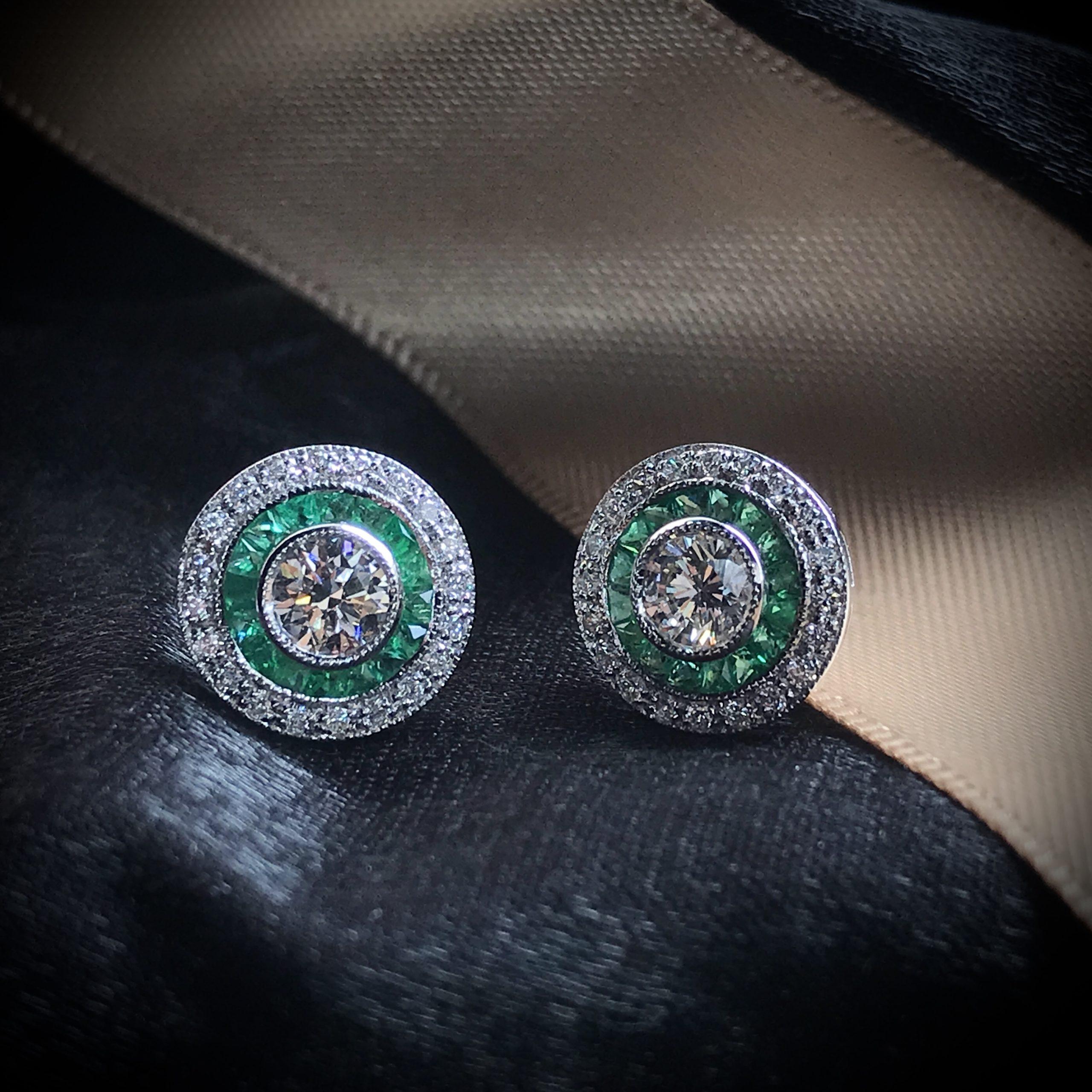These Art-Deco stud earrings are completely spectacular! The vibrant color stone (you can select Blue Sapphire, Emerald, Ruby) is a specialty cut to surround the excellent round brilliant cut center diamond, which is in a thin bezel with mil-grain