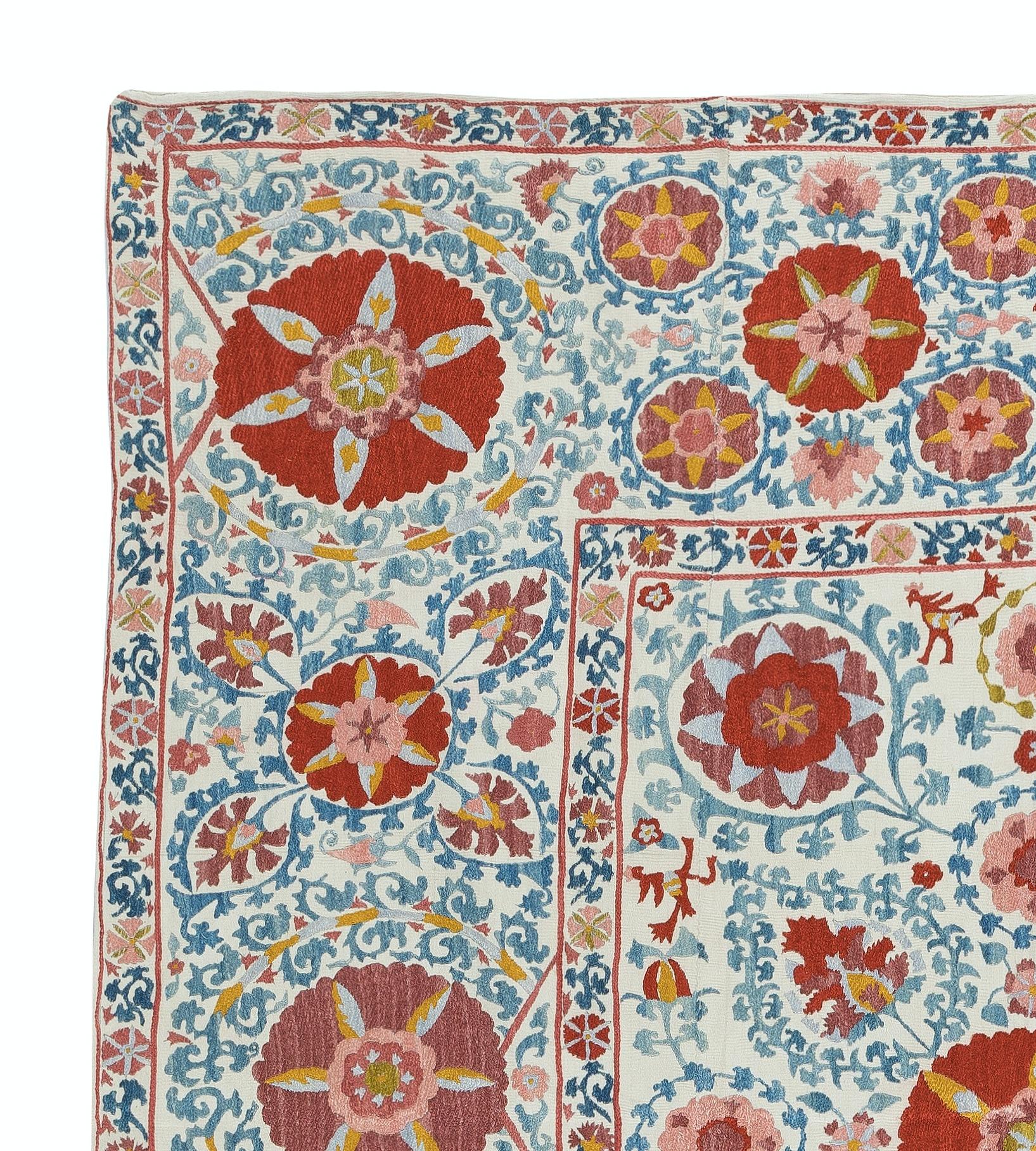 Introducing our exquisite new suzani hand embroidered wall hanging, a captivating piece that combines ancient craftsmanship with modern artistry. This embroidered cloth is not just a suzani throw, but a remarkable suzani wall hanging that will