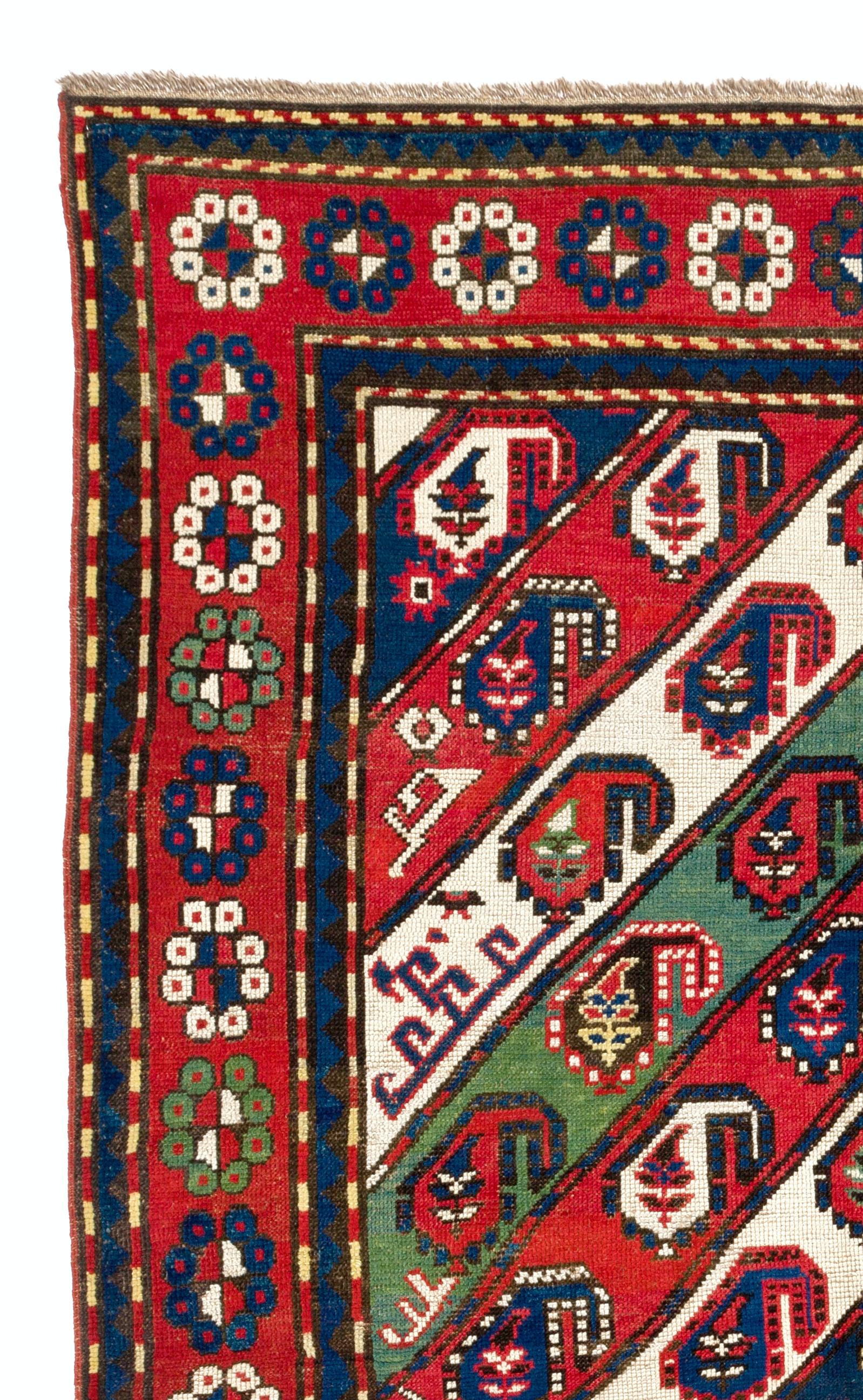 Antique Caucasian Gendje Kazak rug with diagonal stripes decorated with Botehs and other attractive small design elements and with a red border depicting many flowers. Size: 4.4 x 7.3 Ft
100% wool and natural dyes. Good condition. Provenance: A