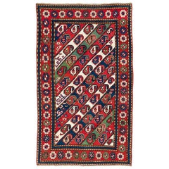 Tappeto caucasico antico Gendje Kazak con strisce diagonali 4.4x7.3 Ft