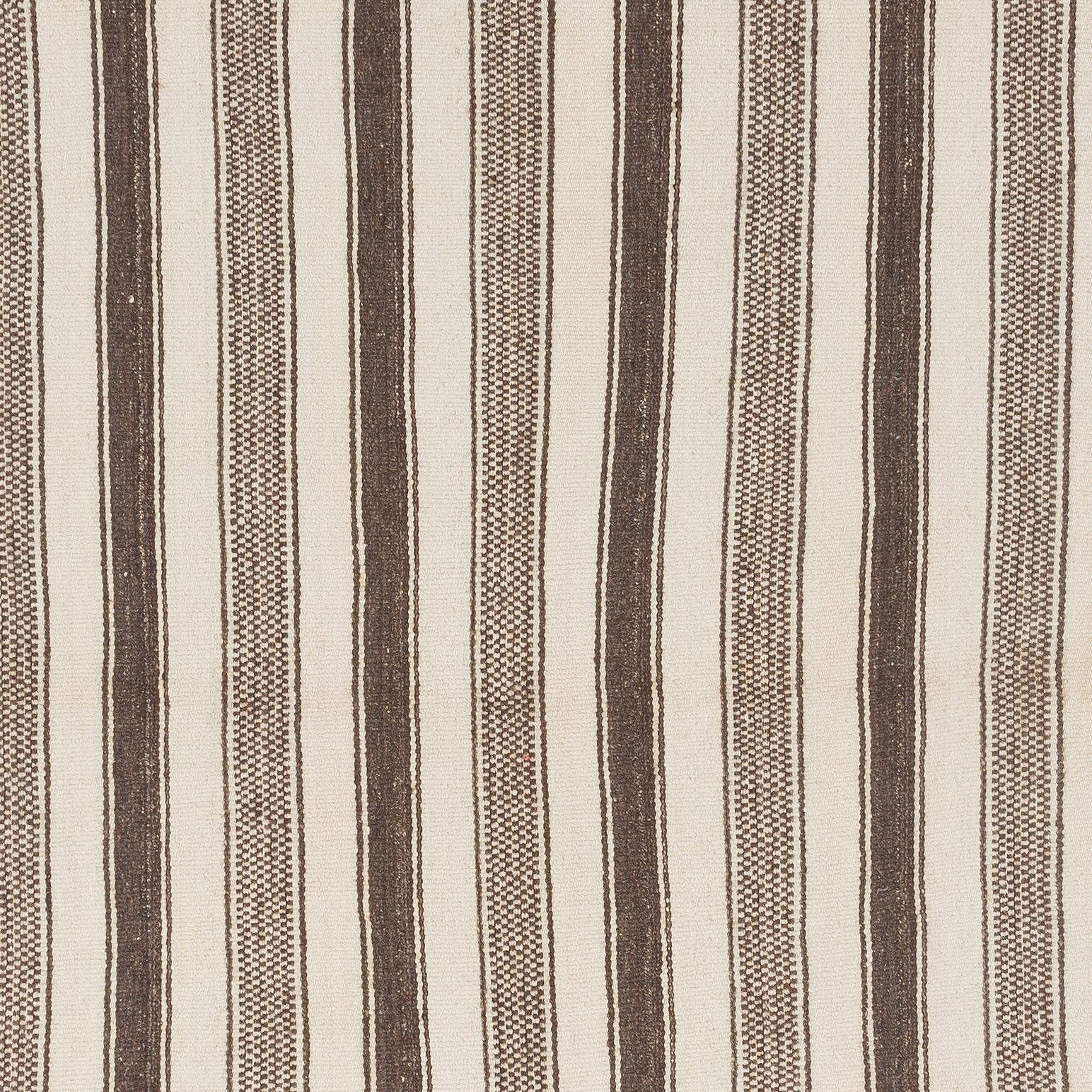 This simple handwoven rug made to be used by the villagers in Central Anatolia. 
100% natural un-dyed wool. Very good condition, sturdy and clean.
Ideal for both residential and commercial interiors. Measures: 4.4 x 9.2 ft.