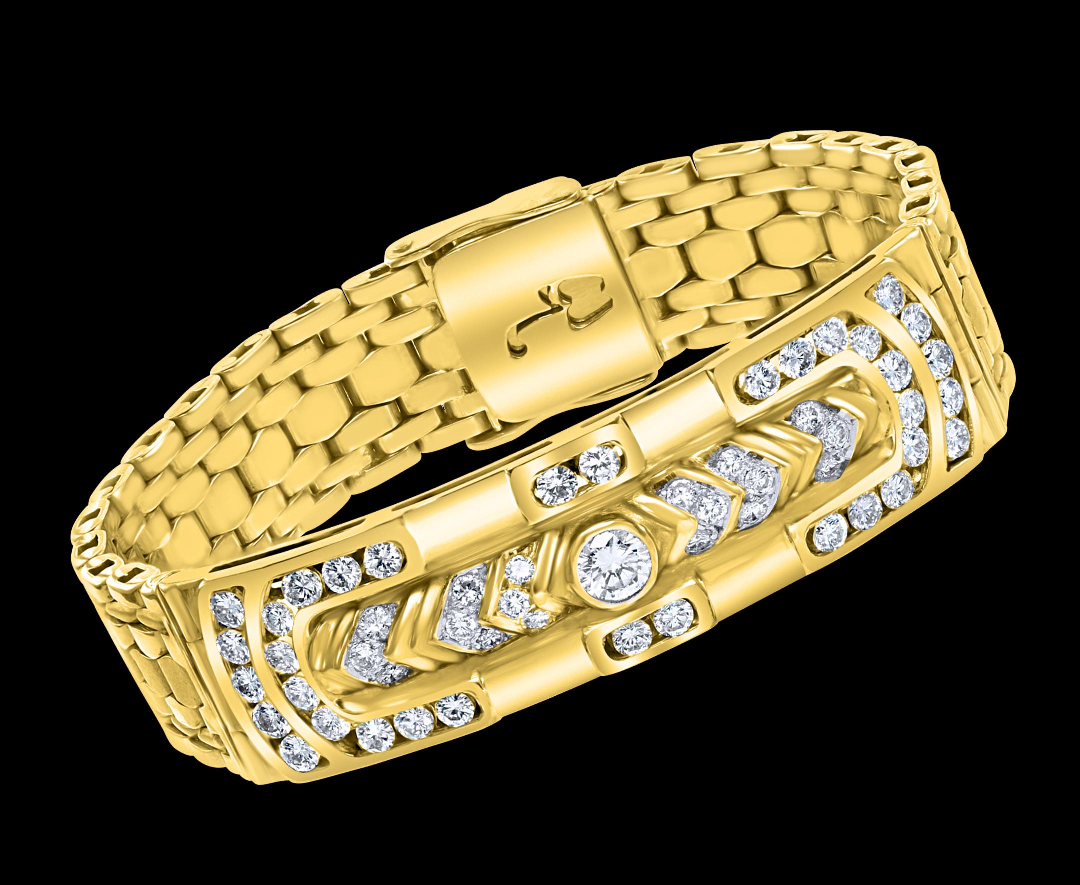 A statement of true, classic elegance, this 18 karat Yellow Gold  Bracelet with a center solitaire diamond of approximately half Carat .The center plate Has multiple Brilliant round cut diamonds . The interlocking  links of gold   provide