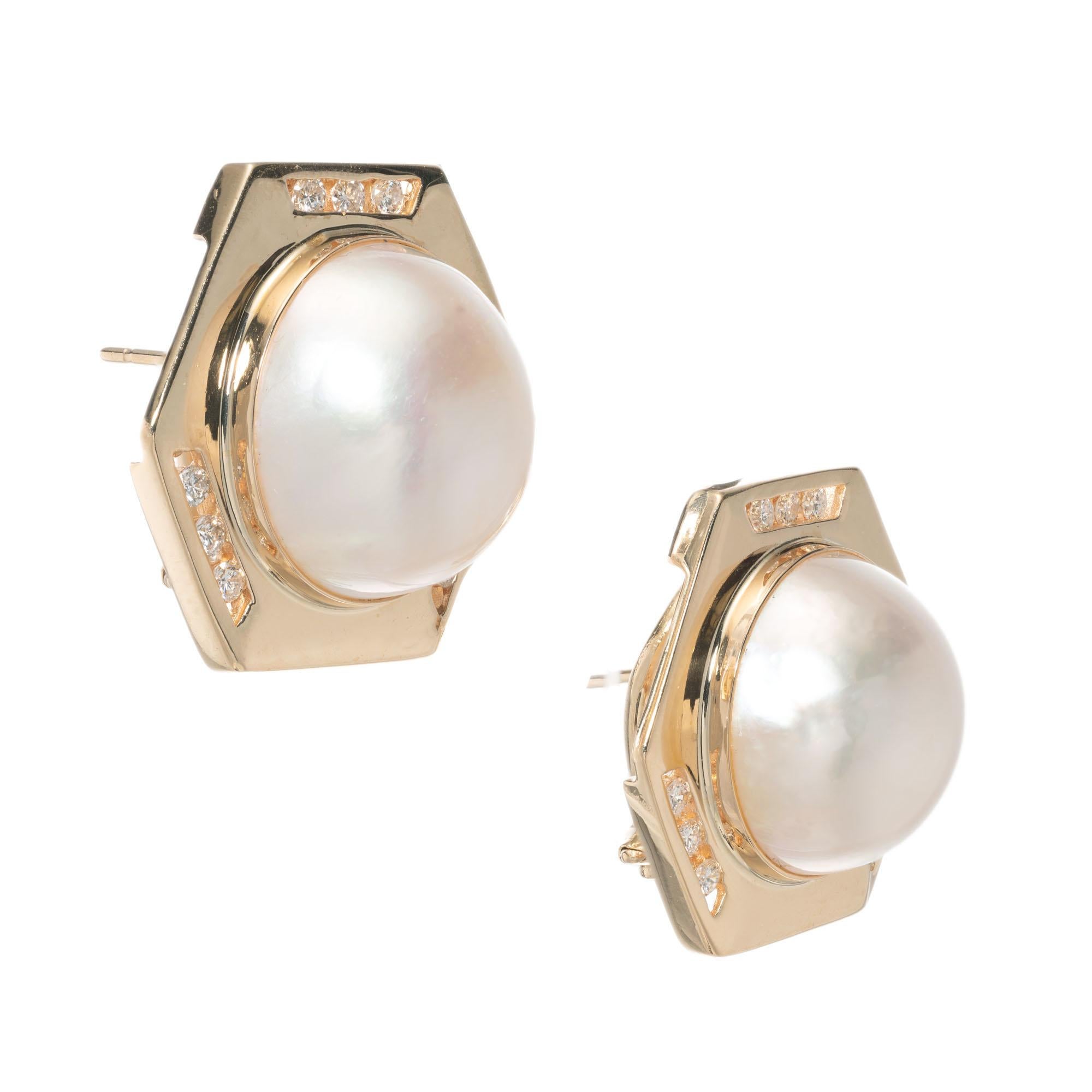 15mm Mabe pearl clip post diamond earrings in 14k yellow gold 

18 round brilliant cut diamonds I VS approx. .45cts
2 Mabe rose hue pearls .15mm
14k yellow gold 
Stamped: 14k
13.8 grams
Top to bottom: 22mm or 7/8 Inch
Width: 24.4mm or 5/16