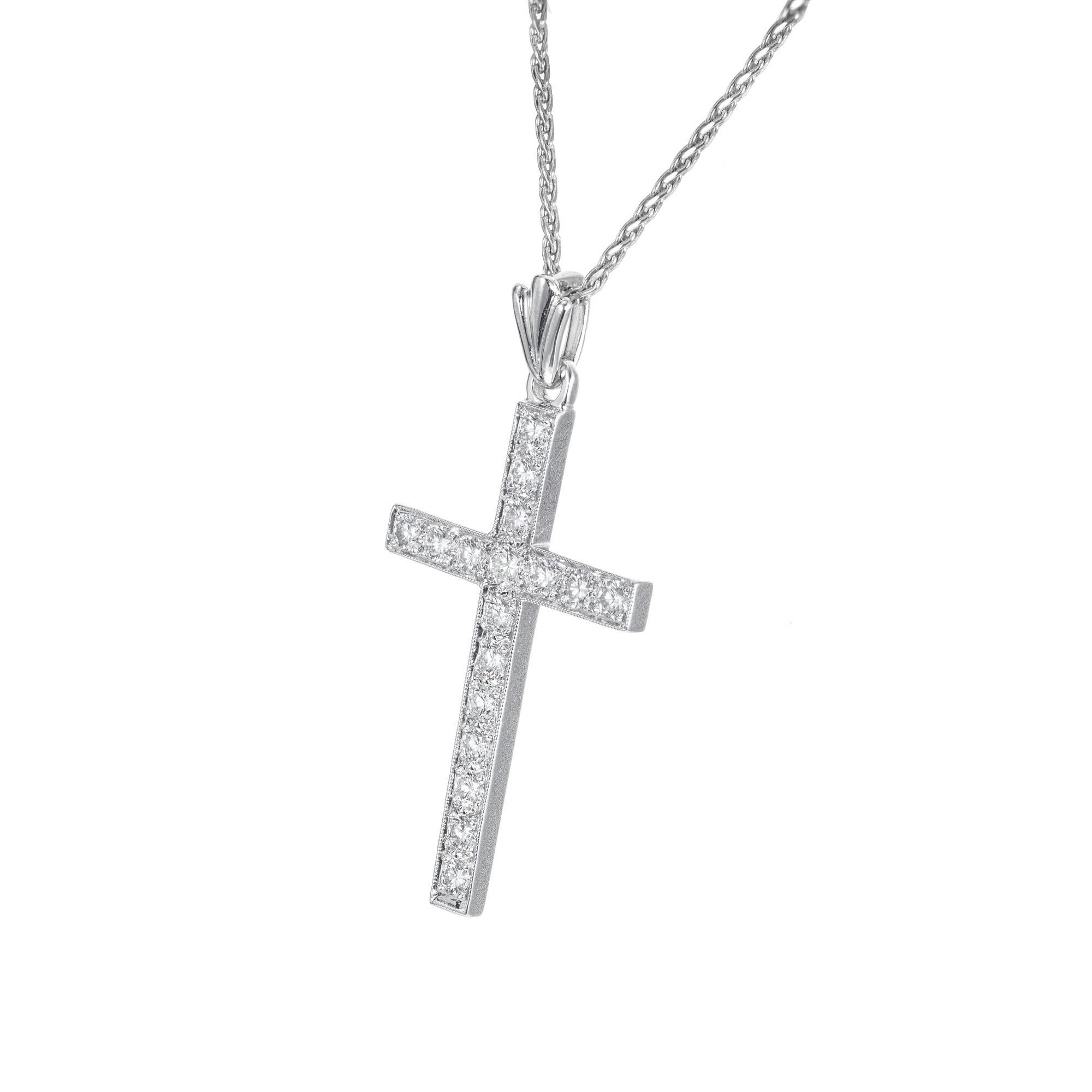 17 round brilliant cut diamond cross pendant necklace in 14k white gold on a 18 inch 14k white gold chain.  

17 round brilliant cut diamonds, .45cts 
14k white gold 
Stamped: 14KT
6.0 grams
Top to bottom: 34.9mm or 1 1/3 Inch
Width: 17mm or 5/8