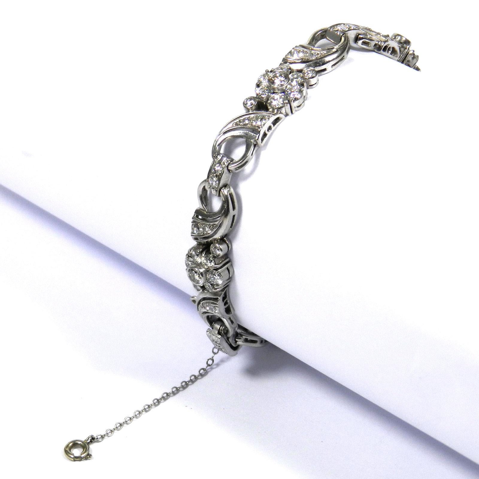 4.5 carat diamond white gold link bracelet 

This elegant diamond bracelet is designed with five rectangular links decorated with flower and leaf motifs and inter-connected with bar-shaped segments, set with a total of 75 sparkling diamonds weighing