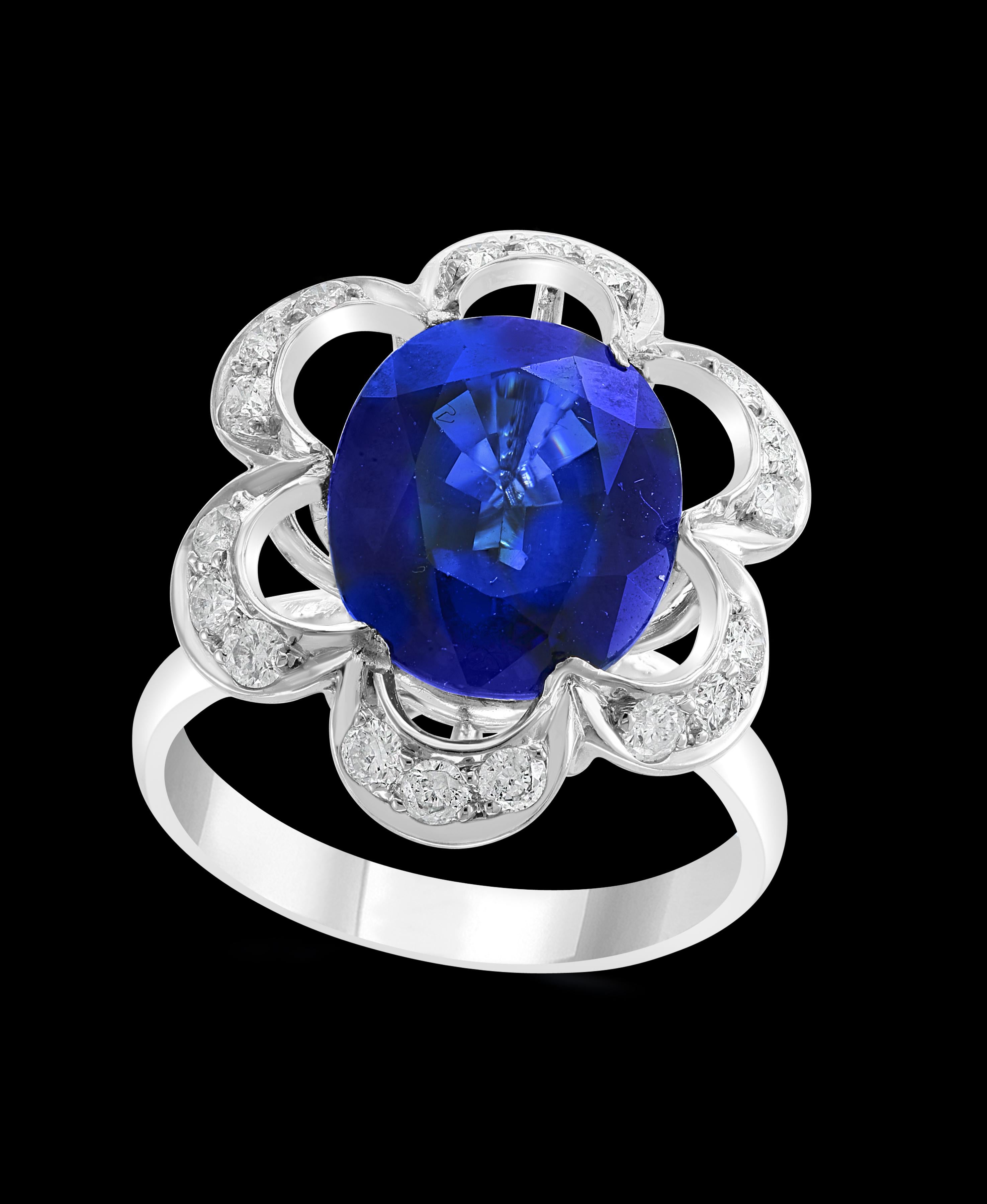
5 Carat  Diffused Blue Sapphire & Diamond 18 Karat  White Gold Cocktail Ring
5 Carat of Diffused  blue Sapphire in Oval Shape
Total Diamond Weight of  brilliant  Round cut diamonds approximately 0.65 carats
Gold : 18 Karat White Gold 8 Gm
Ring size