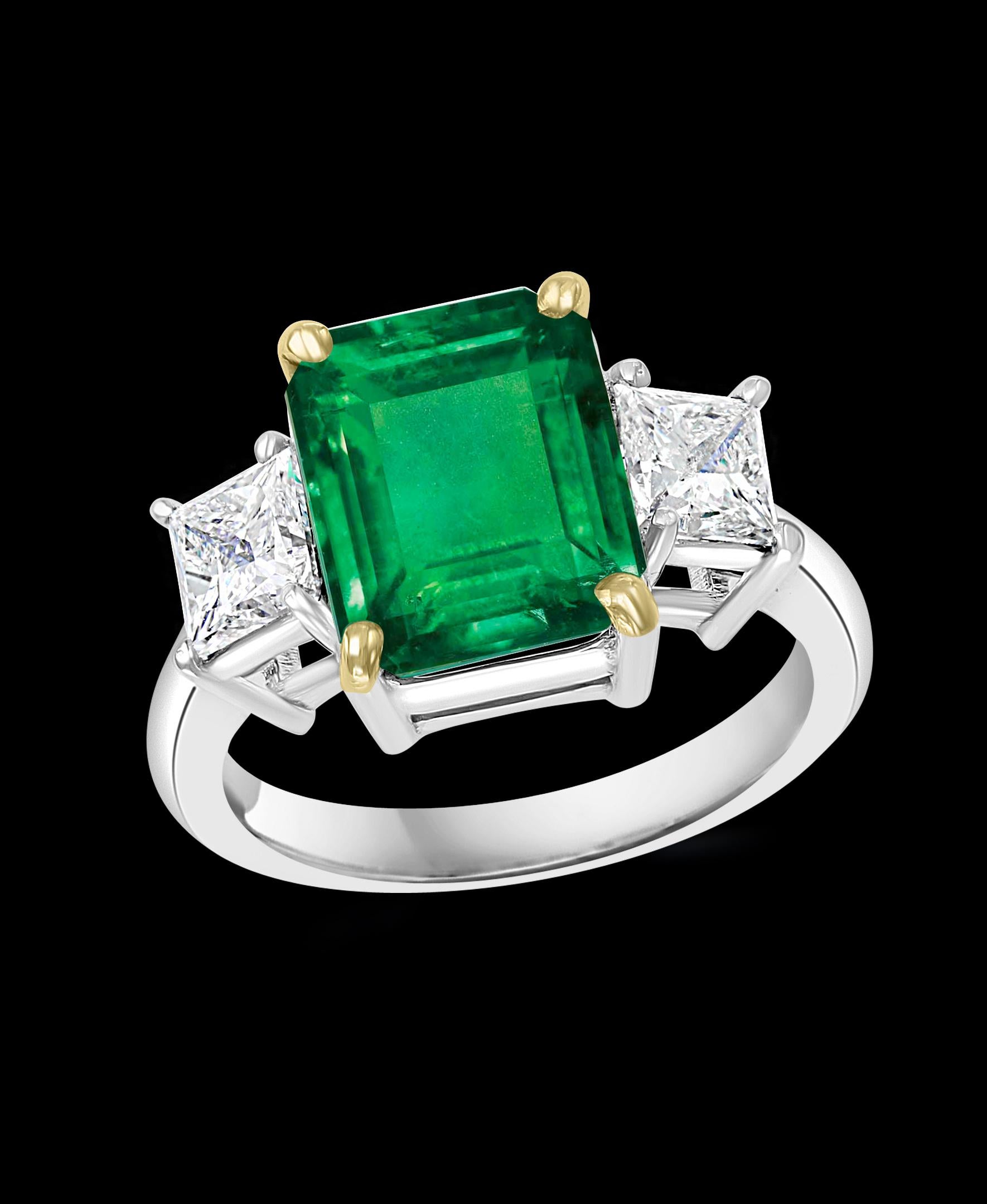 4.5 Carat Emerald Cut Colombian Emerald Diamond 18 Karat White gold Ring
Estate piece Natural Emerald 
Two Emerald cut Diamonds on either side of the Emerald. 
18 K White gold 6.2 Gm
2 Diamonds: approximate 1.4 ct, Total weight 
 0.7 ct each