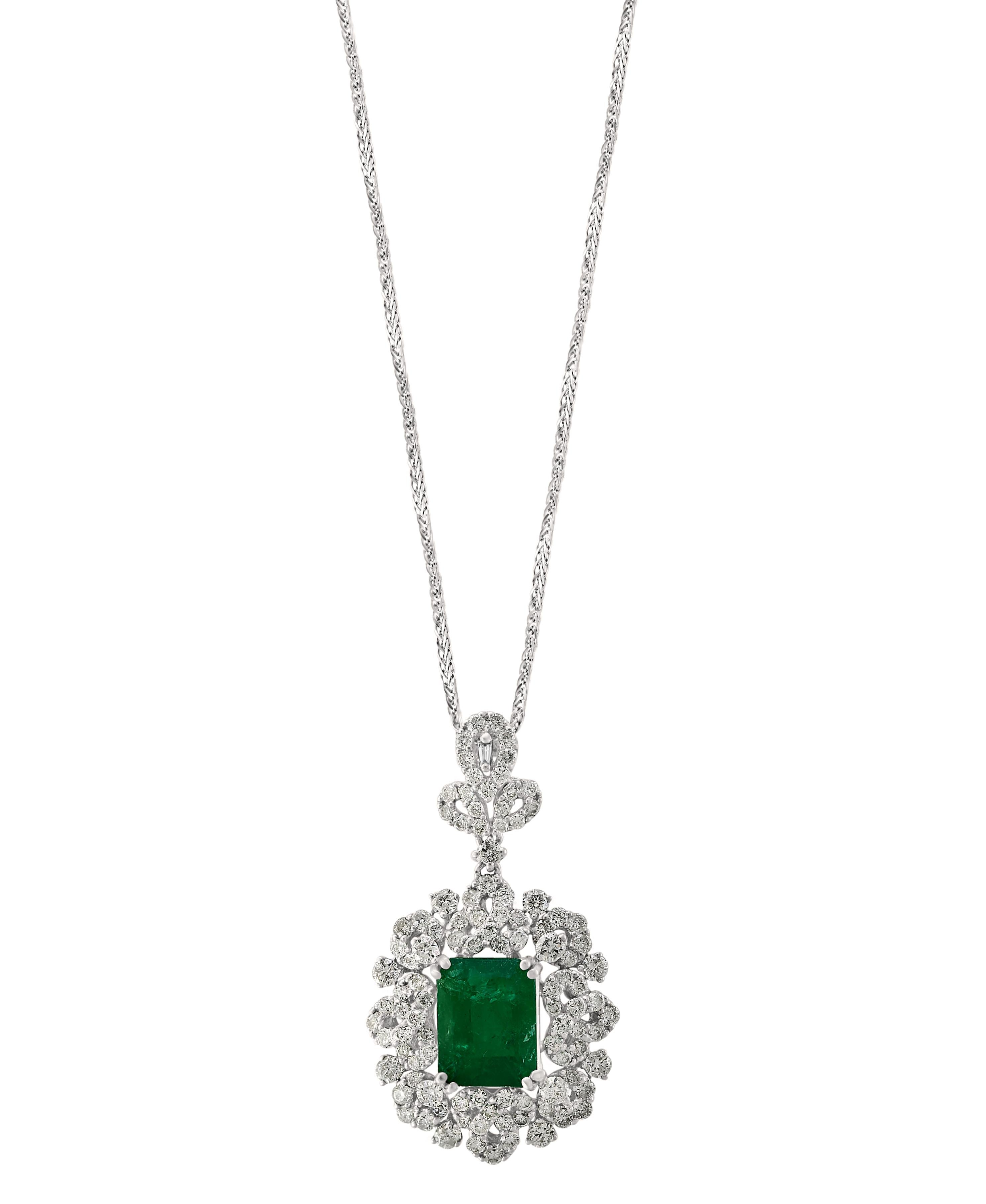 Approximately 4 Carat Emerald Cut Emerald and Diamond Pendant Necklace Enhancer
This spectacular Pendant Necklace consisting of a single Emerald cut emeralds approximately 4 Carat. The Emerald is surrounded by approximately 2 Carats of brilliant cut