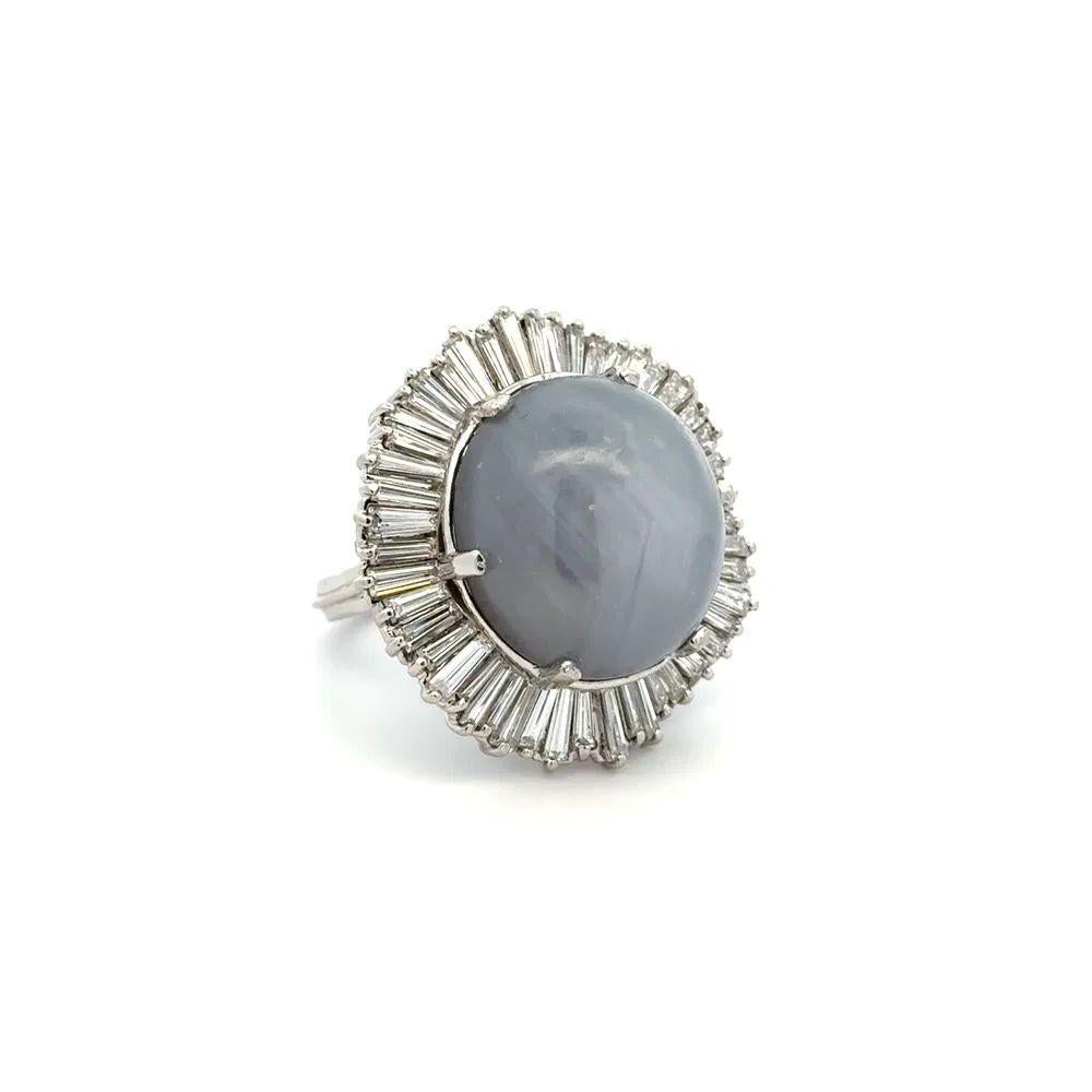 Simply Beautiful! Finely detailed Awesome Gray Blue Star Sapphire and Diamond Platinum Statement Ring. Centering a securely nestled Hand set 45 Carat Gray Blue Star Sapphire. Surrounded by 5.00tcw Baguette Diamonds. Hand crafted Platinum mounting.
