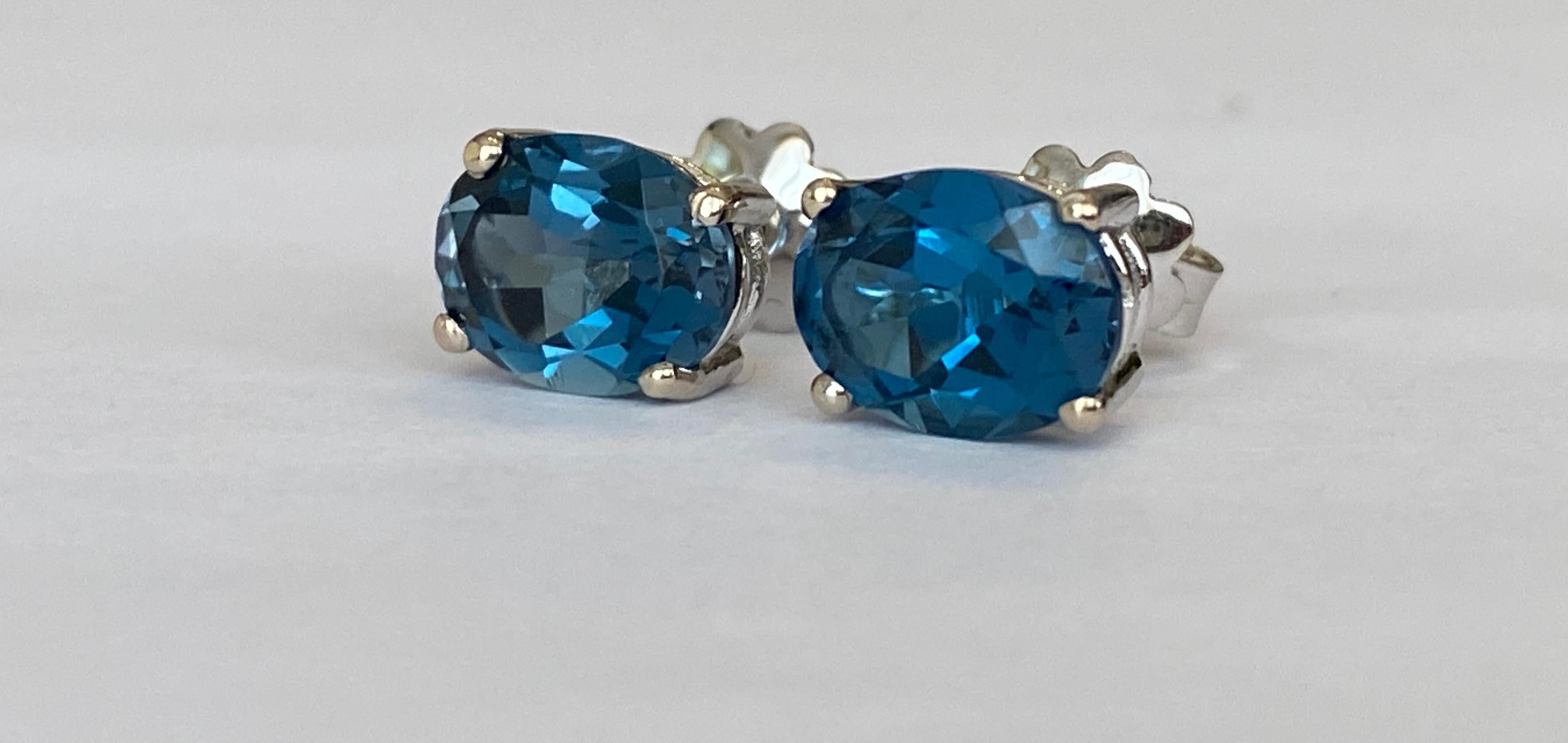 Oval Cut 4.5 Carat London Blue Topaz Gold Earrings For Sale