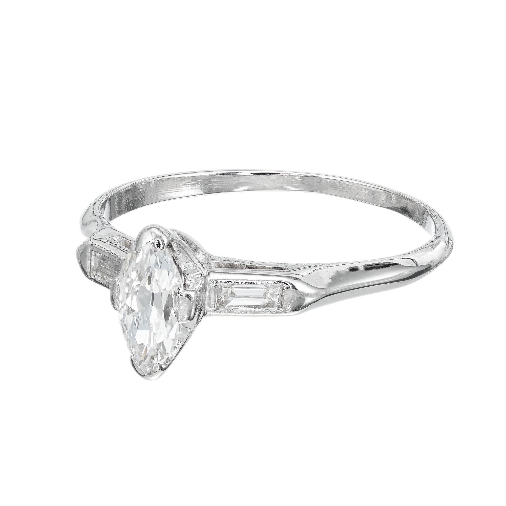 1950's Marquise diamond engagement ring. Marquise center stone set in platinum with two baguette side diamonds. EGL certified# US64833201D

1 Marquise diamond, approx. total weight .45ct, F, SI1, Depth: 59% Table: 62%. 
2 straight baguette cut