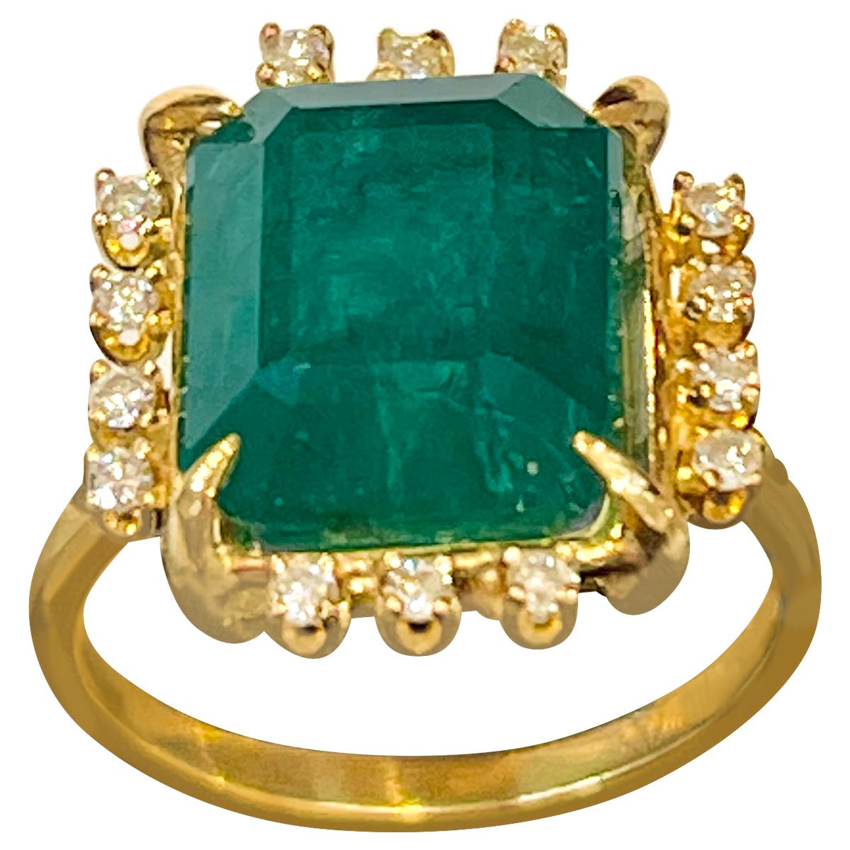 A classic, Vintage ring 
Approximately  4.5 Carat Natural Emerald  Cut Emerald & Diamond Ring 14 Karat Yellow  Gold Size 4.2
Intense green color, Beautiful stone with shine and luster  but has small  inclusions as all natural emeralds have