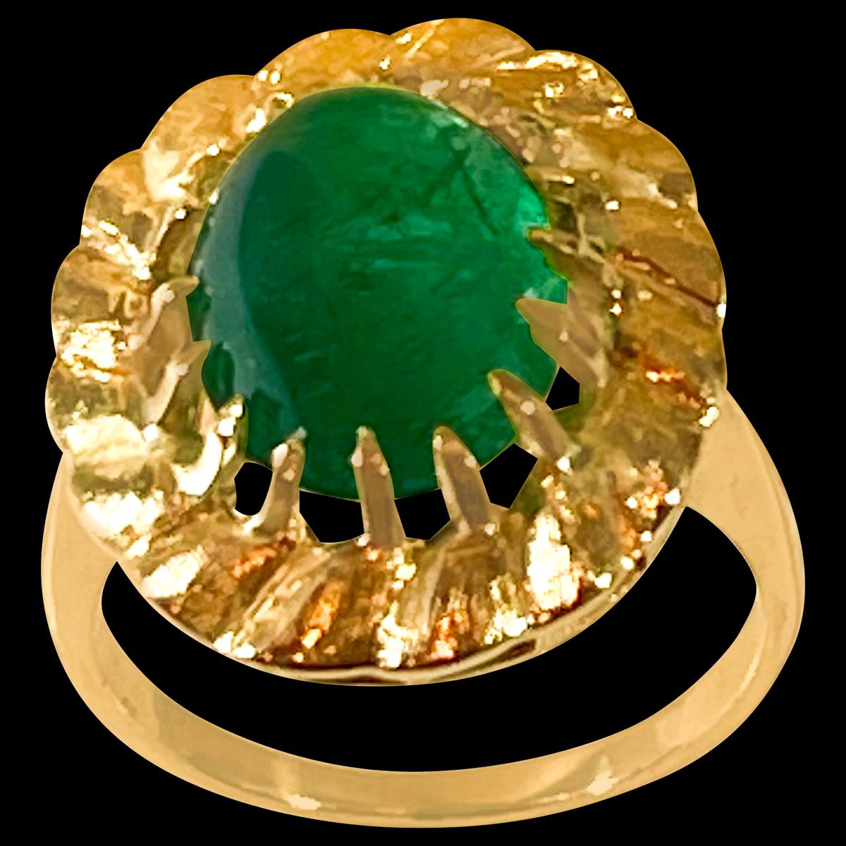 A classic, Cocktail ring 
Large size Emerald  cabochon approximately 4.5 Carat Emerald , Estate with no color enhancement. 
Gold: 14 Karat Yellow  gold ,
Weight: 7.5 gram with stone 
simple ring , no bling 
Emerald: 4.5 Carat 
Origin : Zambia
Color: