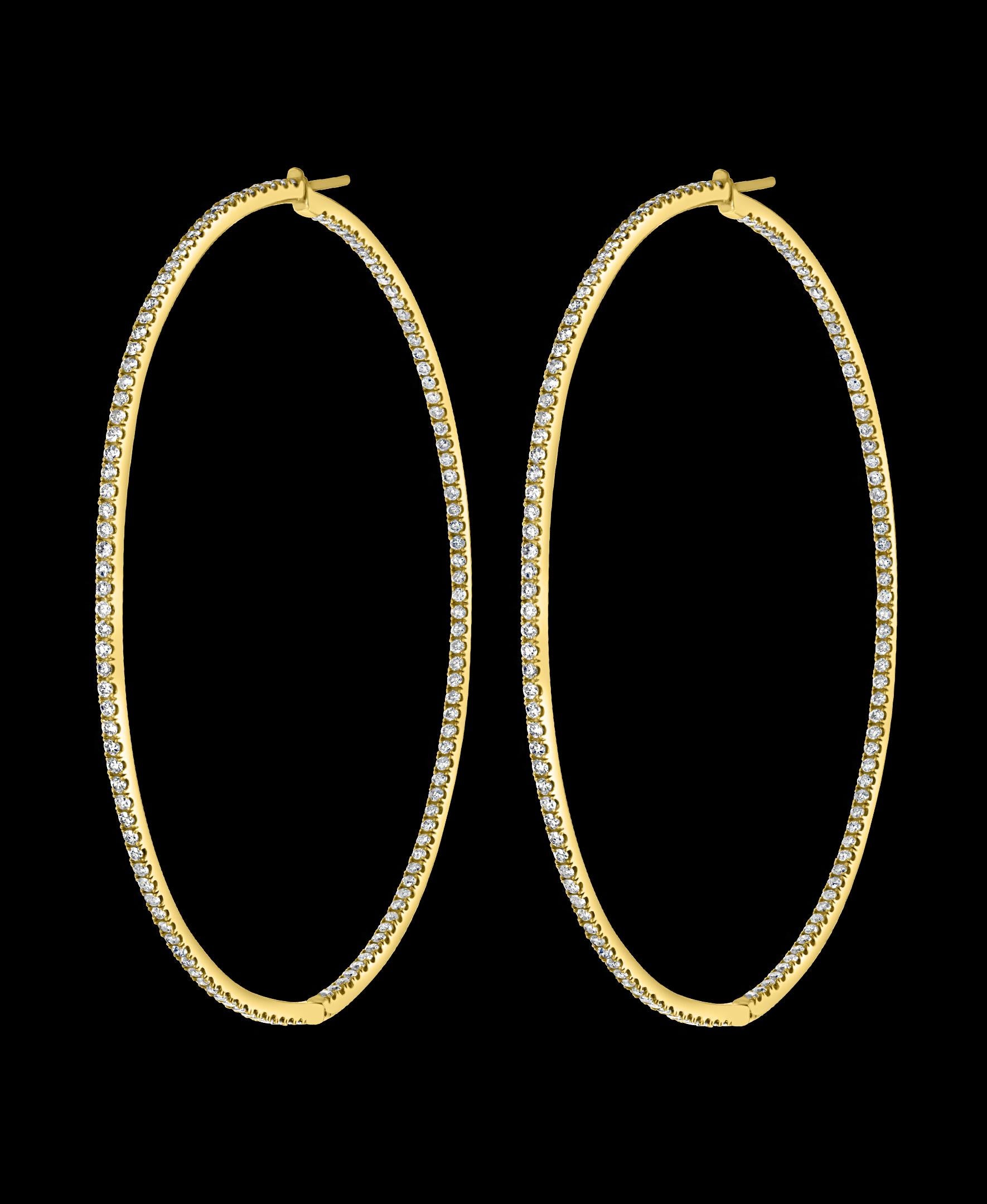 4.5 Carat Very Large Diamond Hoop Gala Cocktail Earrings in 14 Karat Yellow Gold
A fabulous pair of Hoop earrings with an enormous amount of look and sparkle!
These exquisite pair of earrings features round Brilliant cut diamonds   which are set