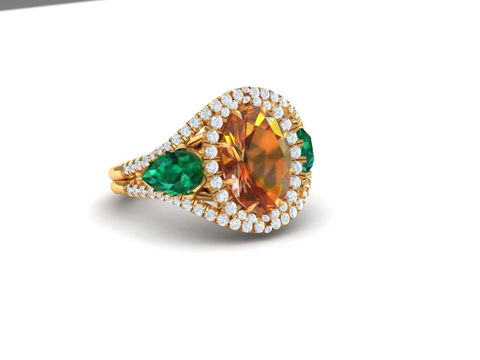 A classic combination of rich golden yellow orange browns can be seen in this oval cut Citrine which weighs 2.5 carats.  This stunner of a center stone is flanked by two twinning Pear shape green emeralds.  Each emerald weighs apprx. .40-.55 carats.
