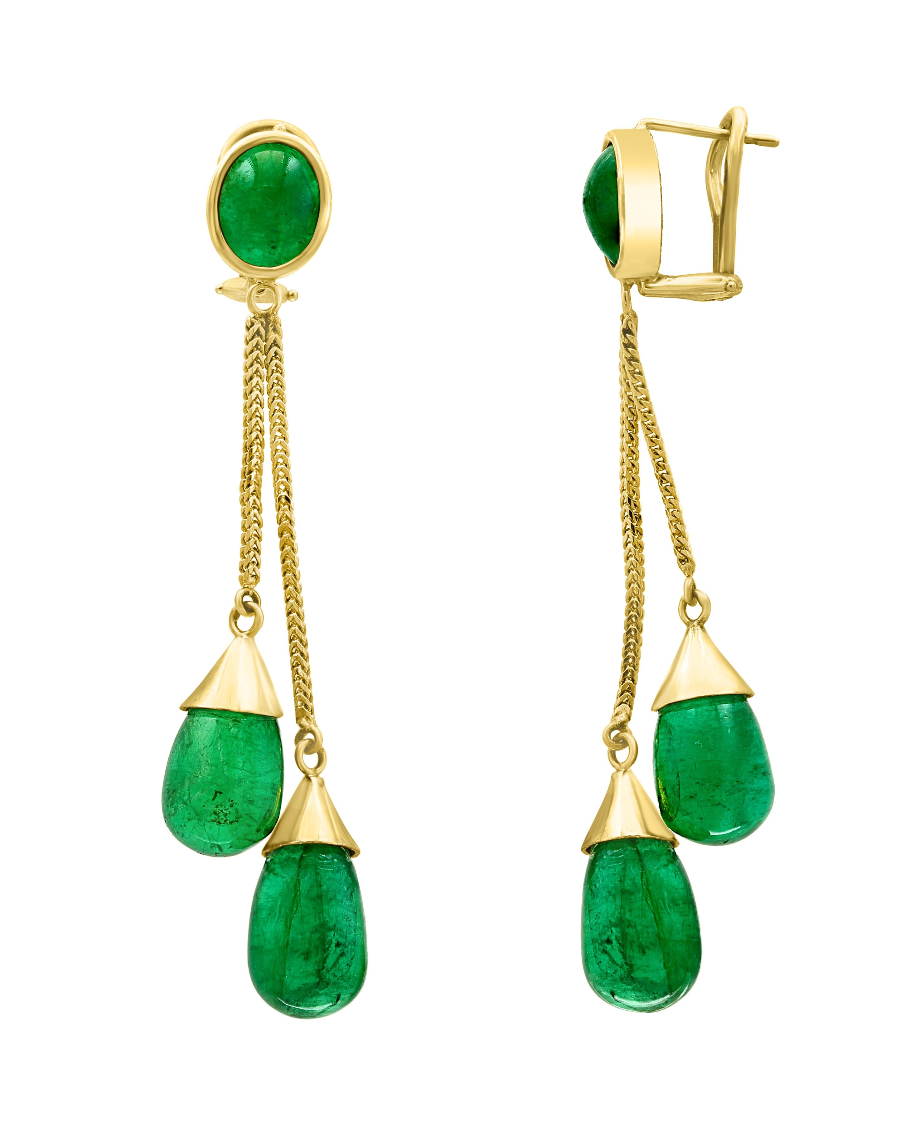 45  Carats Emerald Drop Earrings  18 K Gold
This exquisite pair of earrings are beautifully crafted with 18 karat yellow gold  weighing 16.5 grams
Two fine  Cabochon Emerald   weighing approximately 7 carats and approximately 45 carats of Emerald