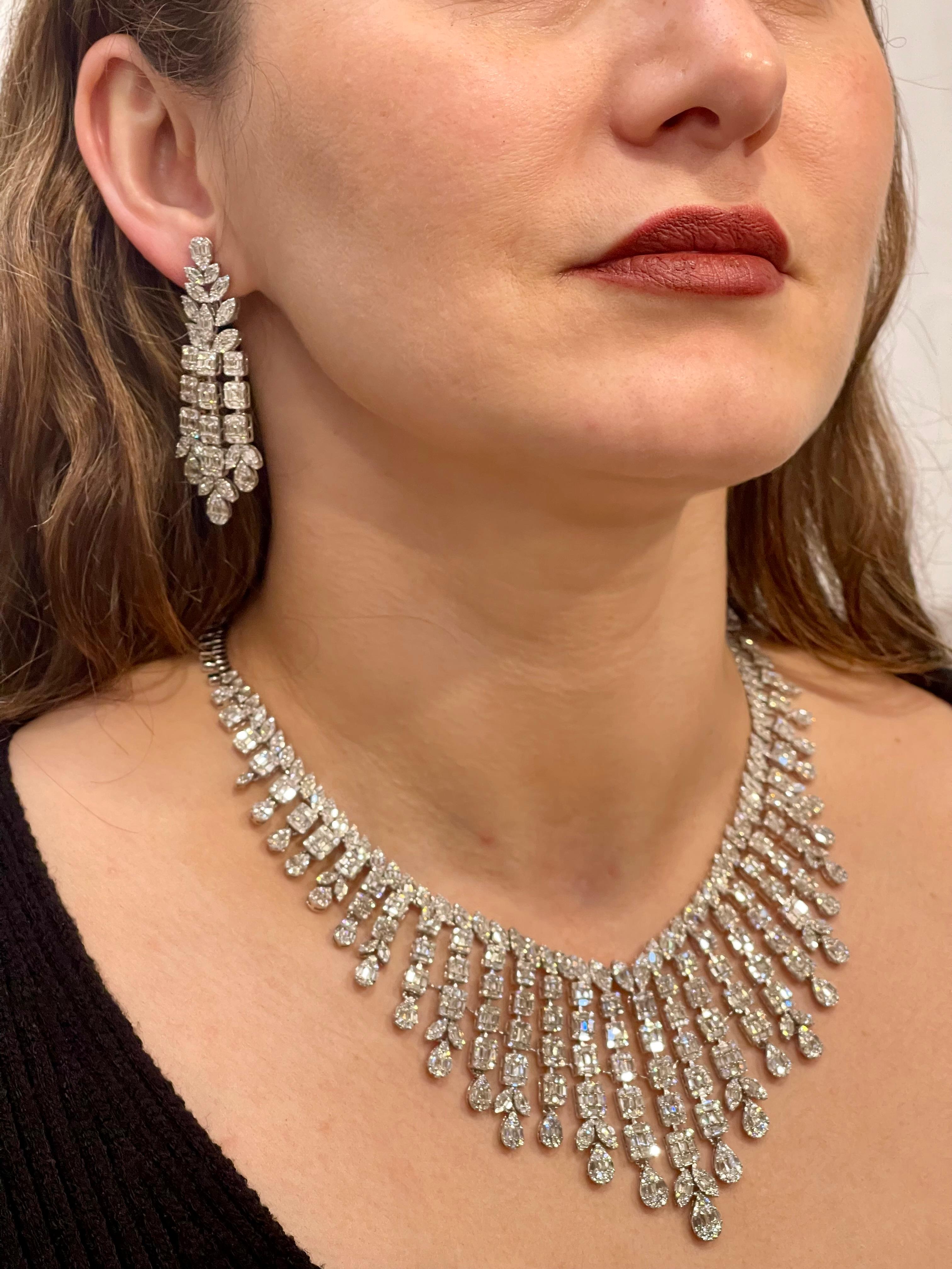 
One of our premium necklace from our Bridal collection.
45 carats of VS quality of Diamonds all mounted in 18 karat gold. Weight of the gold is  110 grams. Matching  dangling earrings are part f the set  .  There are round and Baguettes shape