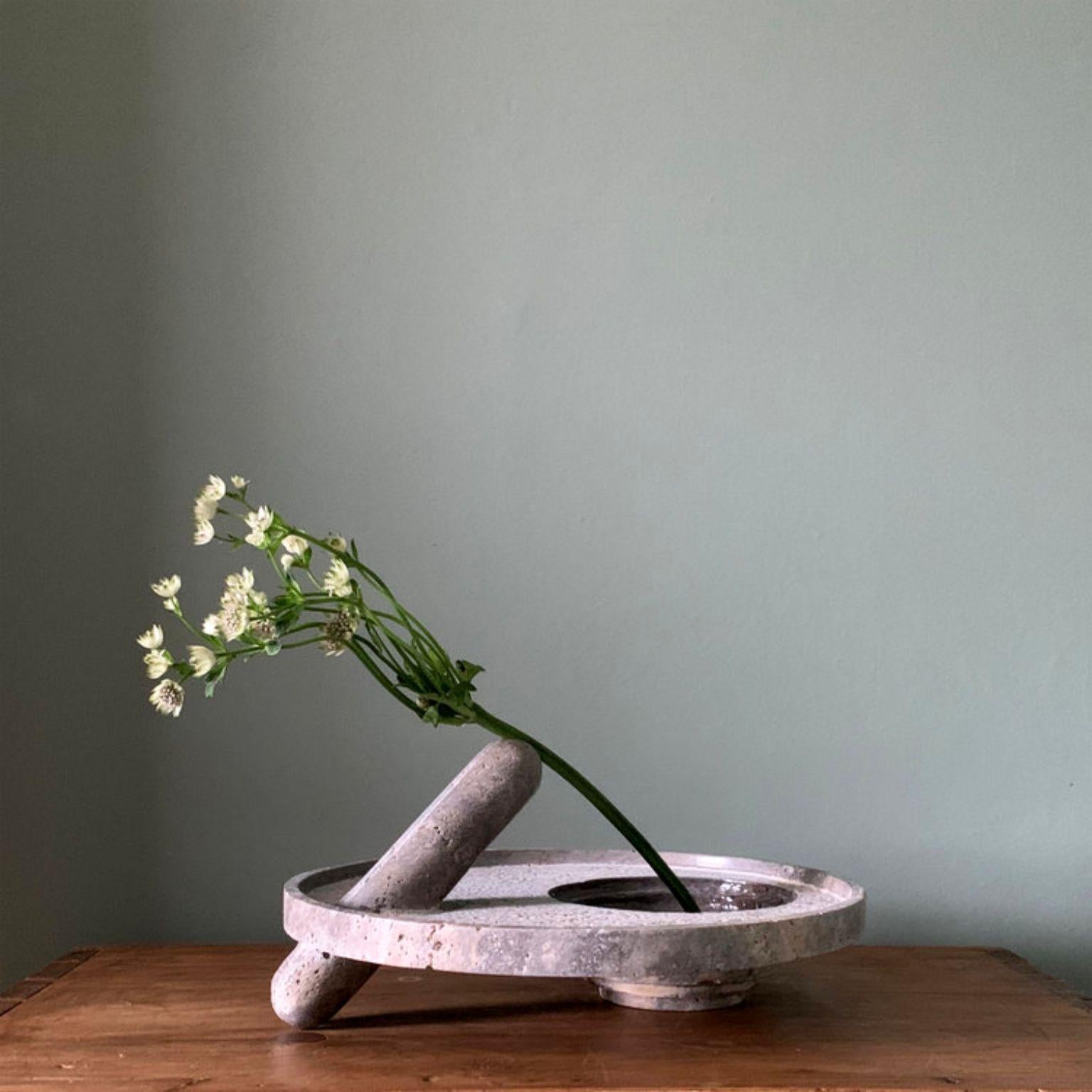 45 degrees single flower vase by Pete Pongsak
2018
Materials: Silver travertine
Dimensions: diameter 34 x height 16 cm
Made in Italy

Hand craved from a single piece of stone.

ARCHIVE & ARCHIVE Studio specializes in creating functional