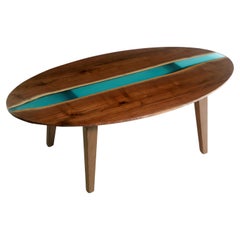 4.5 ft Oval Solid Walnut Resin Tapered Leg Coffee Table