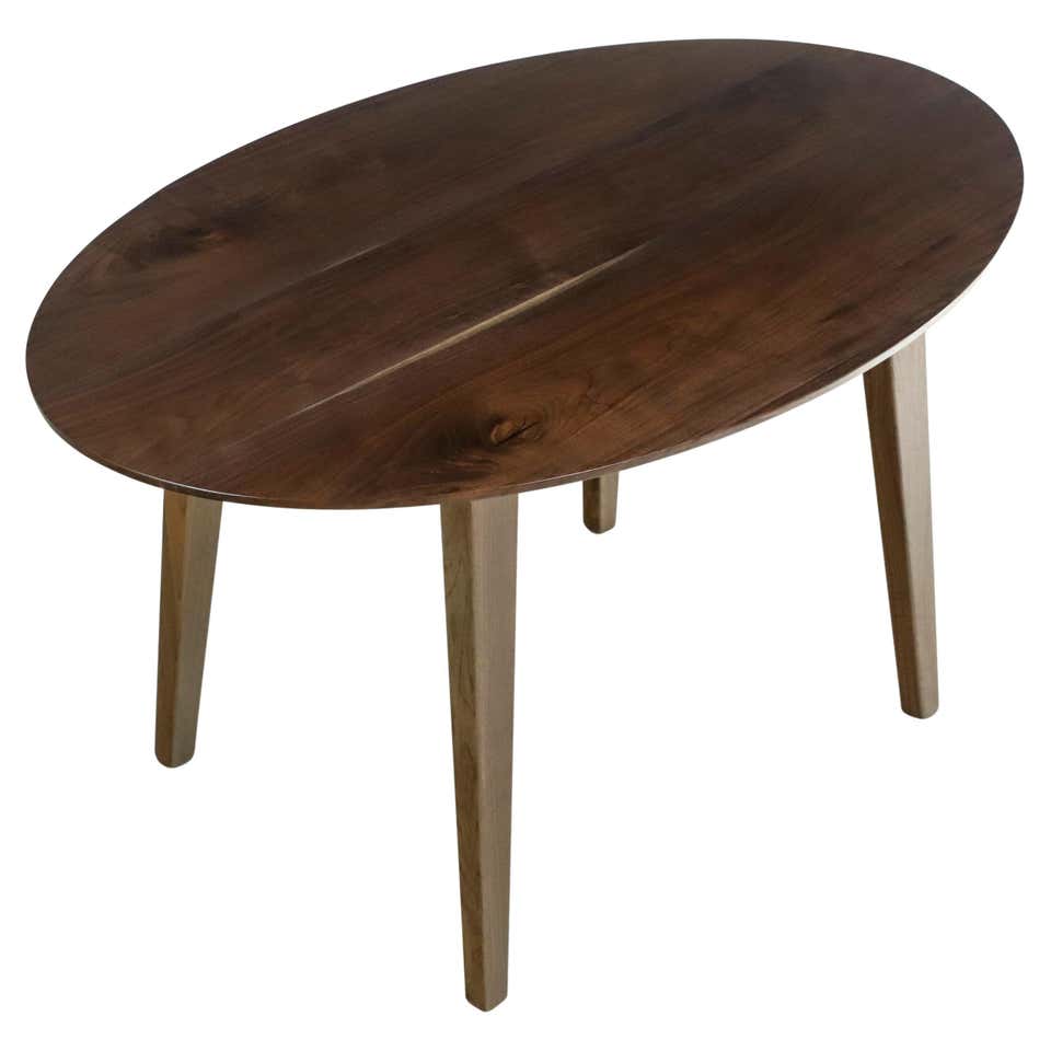4.5 ft Oval Solid Walnut Resin Tapered Leg Coffee Table For Sale at 1stDibs