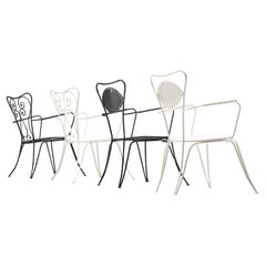 45 Italian Black Patio Chairs with "eye" shape in the back
