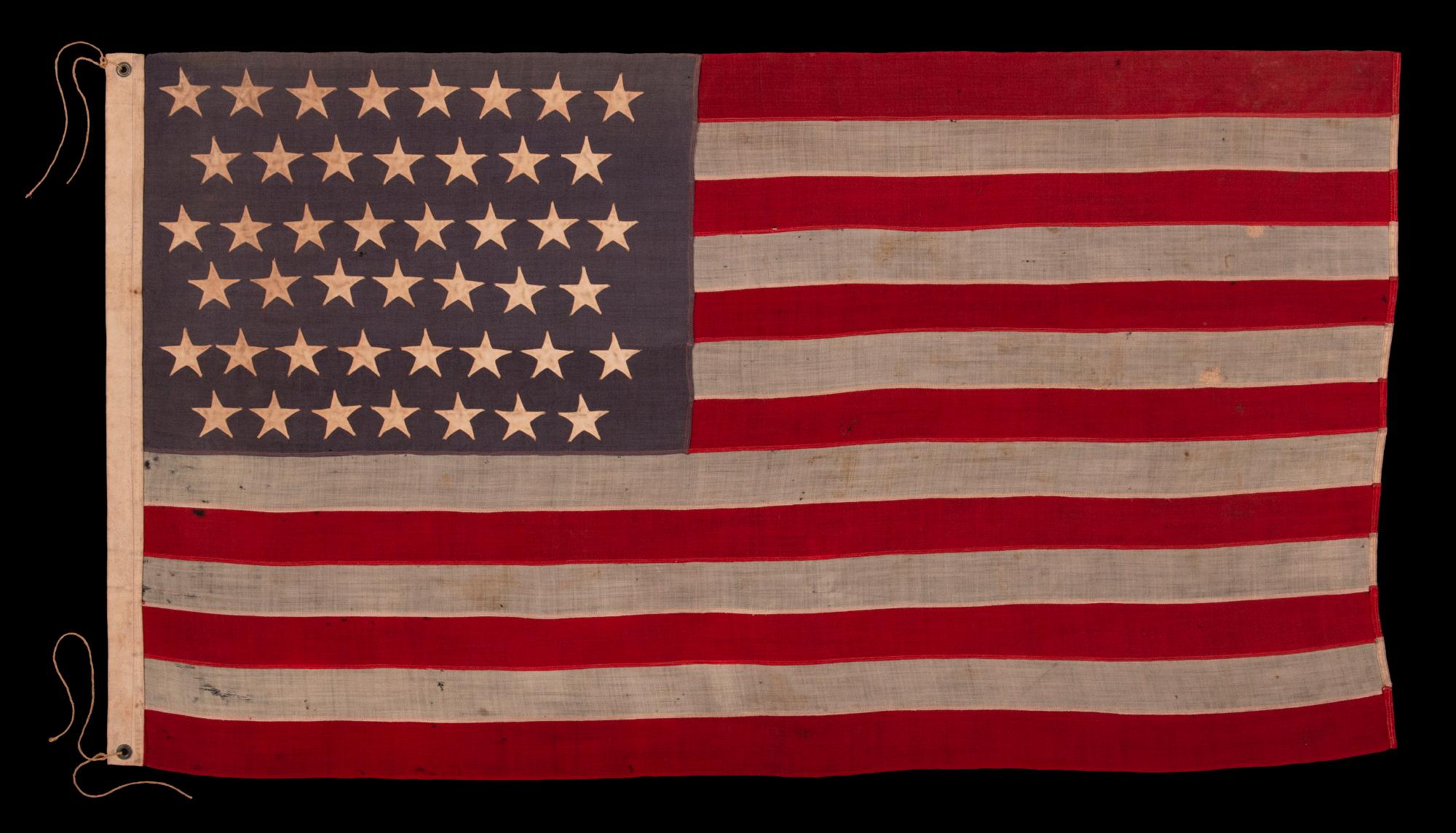 45 STAR ANTIQUE AMERICAN FLAG WITH STAGGERED ROWS OF STARS ON A DUSTY BLUE CANTON; REFLECTS THE PERIOD WHEN UTAH WAS THE MOST RECENT STATE TO JOIN THE UNION, 1890-1896

Utah became the 45th state in 1896. It had been attempting to gain statehood for