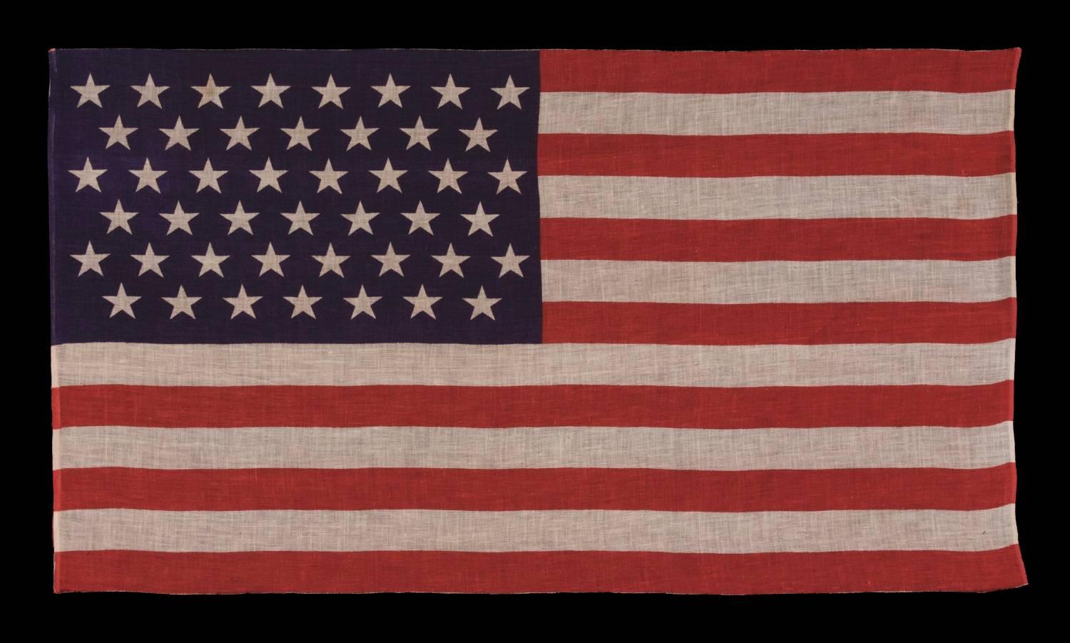 45 stars in staggered rows on an antique American parade flag of the 1896-1908 period, Spanish-American war era, reflecting Utah statehood:

45 star American national parade flag, printed on gauze-like cotton. The stars are arranged in staggered,