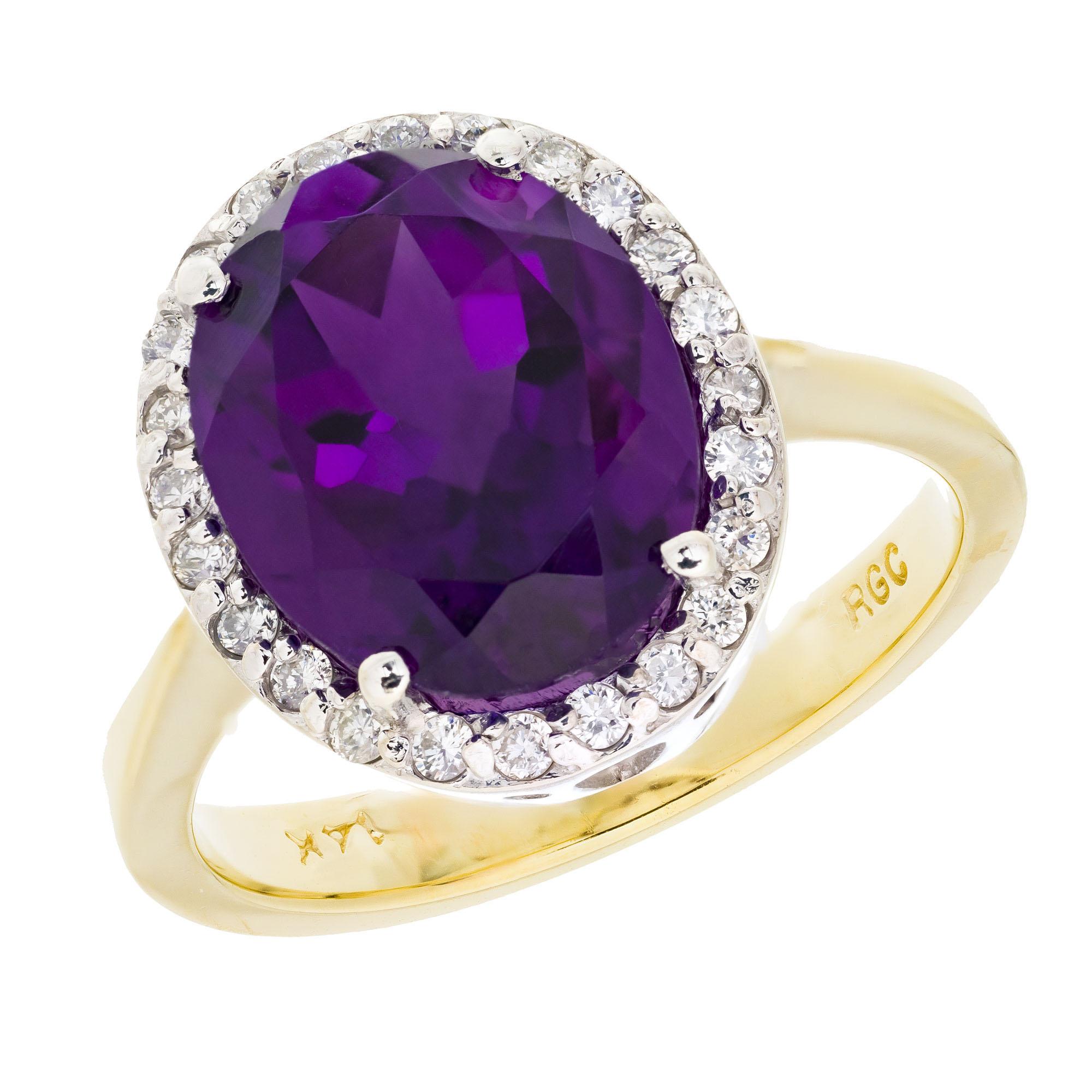 Amethyst and diamond cocktail ring. 4.50ct oval center amethyst with a halo of 24 round full cut diamonds in a 14k yellow gold setting with a white gold top.

1 gem reddish purple oval Amethyst, approx. total weight 4.50cts, 12 x 10mm
24 round full