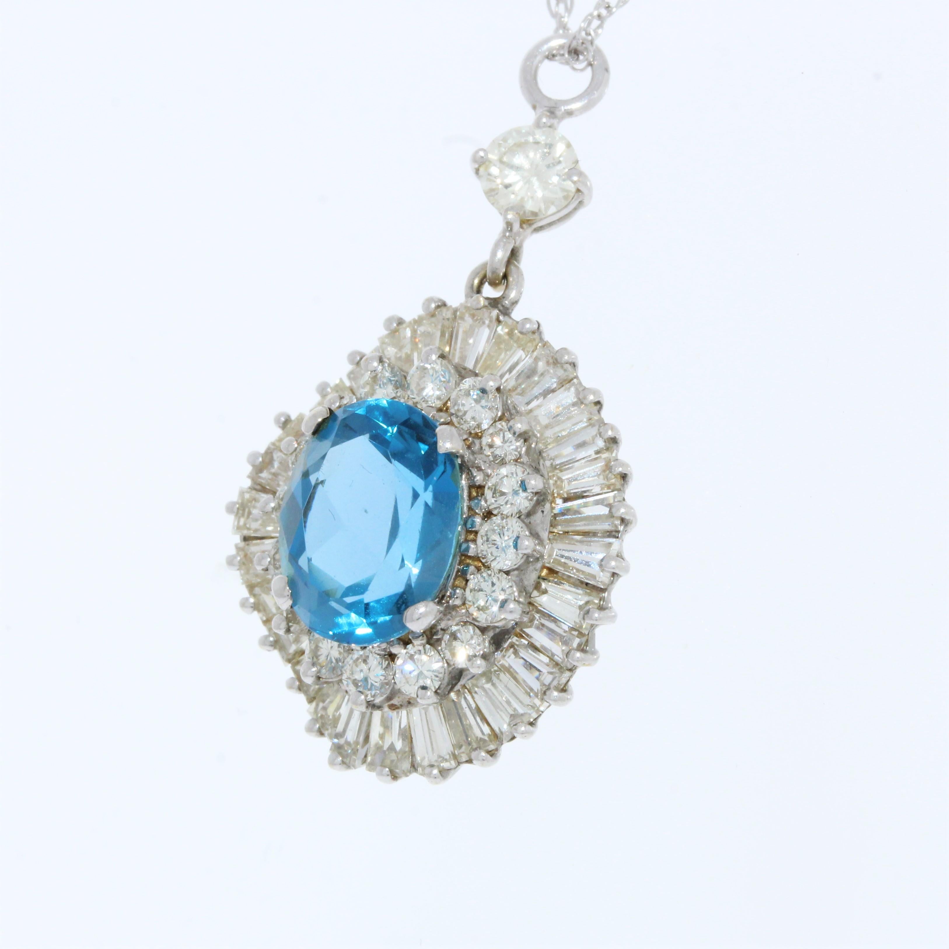 The pendant features a Blue Topaz gemstone set in 14k white gold (14k WG). The gemstone itself is an oval-shaped Blue Topaz, weighing approximately 4.50 carats. Additionally, the pendant includes round-cut diamonds with a quantity of 45.