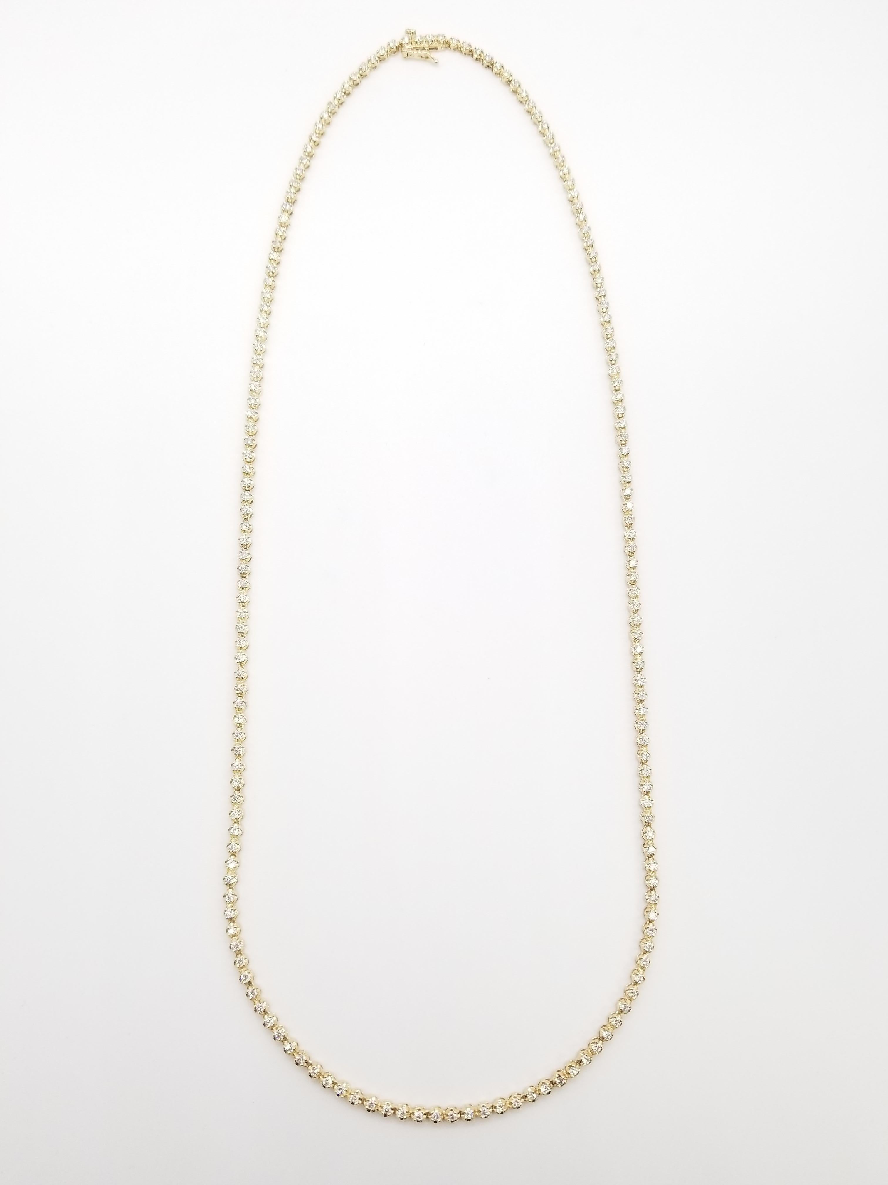 Brilliant and beautiful buttercup necklace, natural round-brilliant cut white diamonds clean and excellent shine. 14k yellow gold buttercup setting. 
20 inch length. Average H-I Color, VS-SI Clarity. Elegance for every occasion.