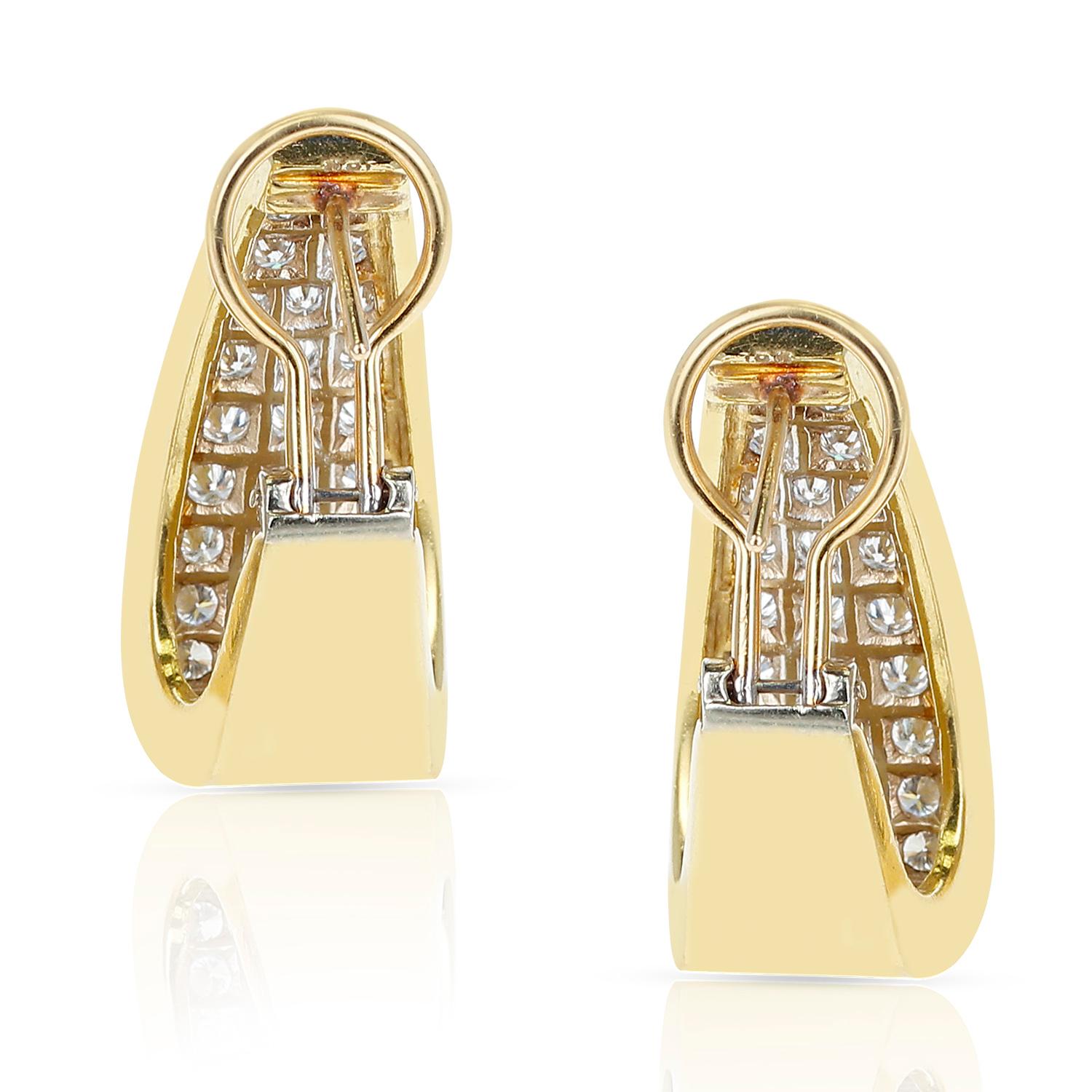 A pair of diamonds and yellow gold earrings made in 18 Karat Yellow Gold. The length of the earring is 1 1/8
