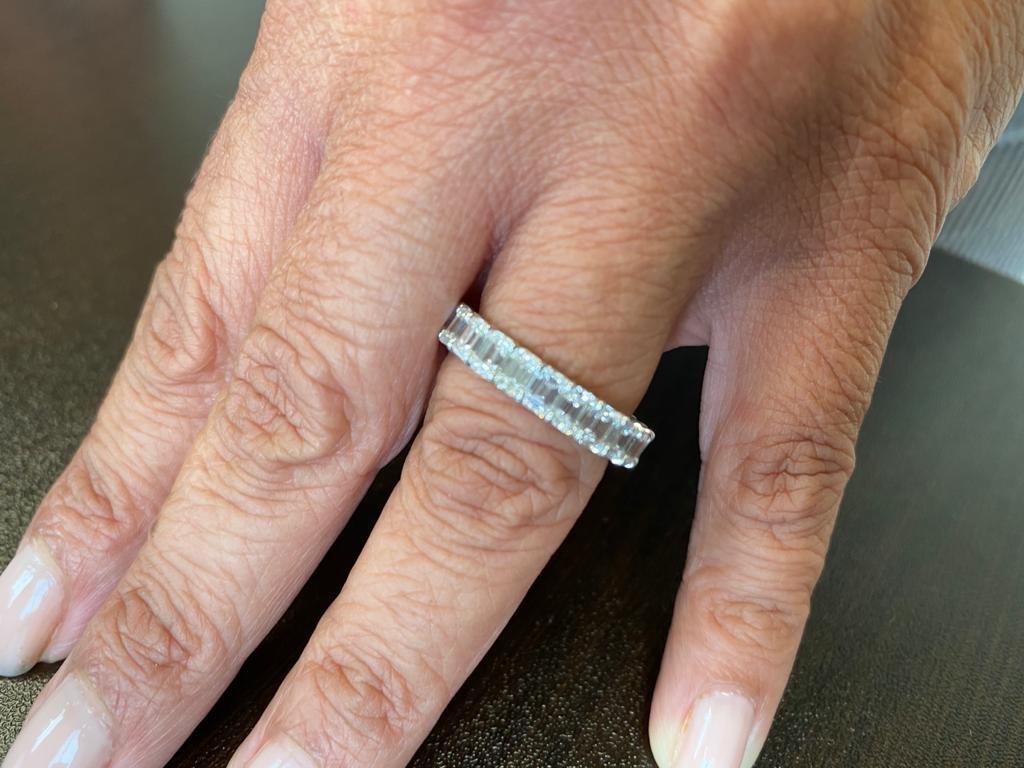 Women's 4.50 Carat Emerald Platinum Eternity Ring For Sale