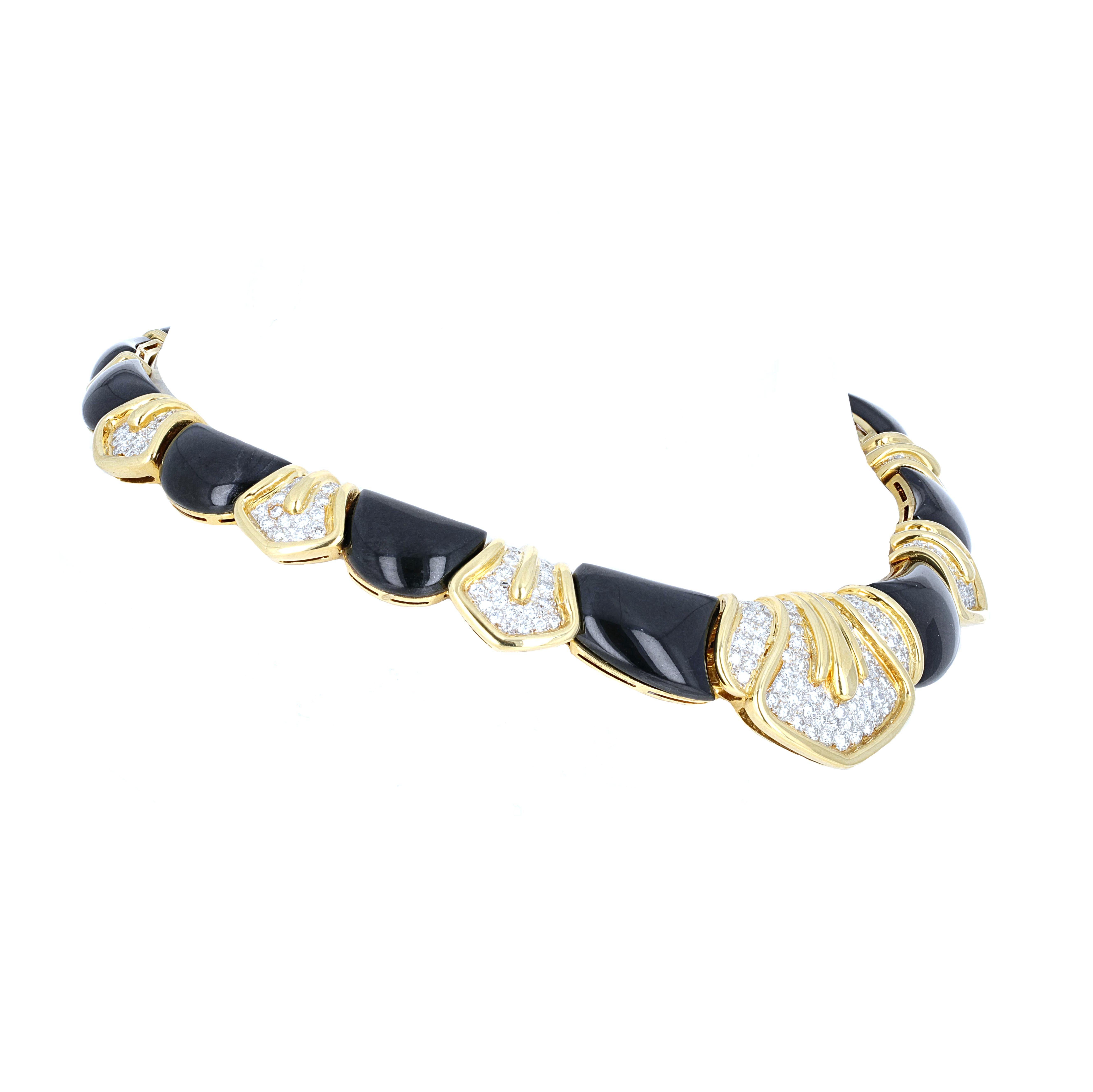 18 karat yellow gold diamond and onyx drop chocker necklace. The necklace has a retro style look. There is an estimated 4.50 carats total weight in diamond. 
