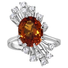 Anello con zaffiro arancione ovale da 4,50 carati in oro bianco 18 carati