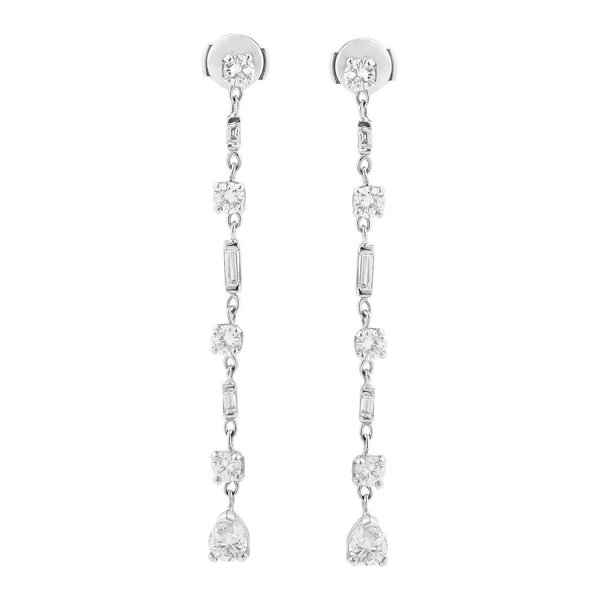Stunning pair of earrings set with brilliant, pear and baguette cut diamonds.

Weight of the diamonds : 4.50 carats

The stones are set with 18 carat white gold (eagle's head hallmark).

Alpas security system clasp

Diamonds quality : 
Color : G