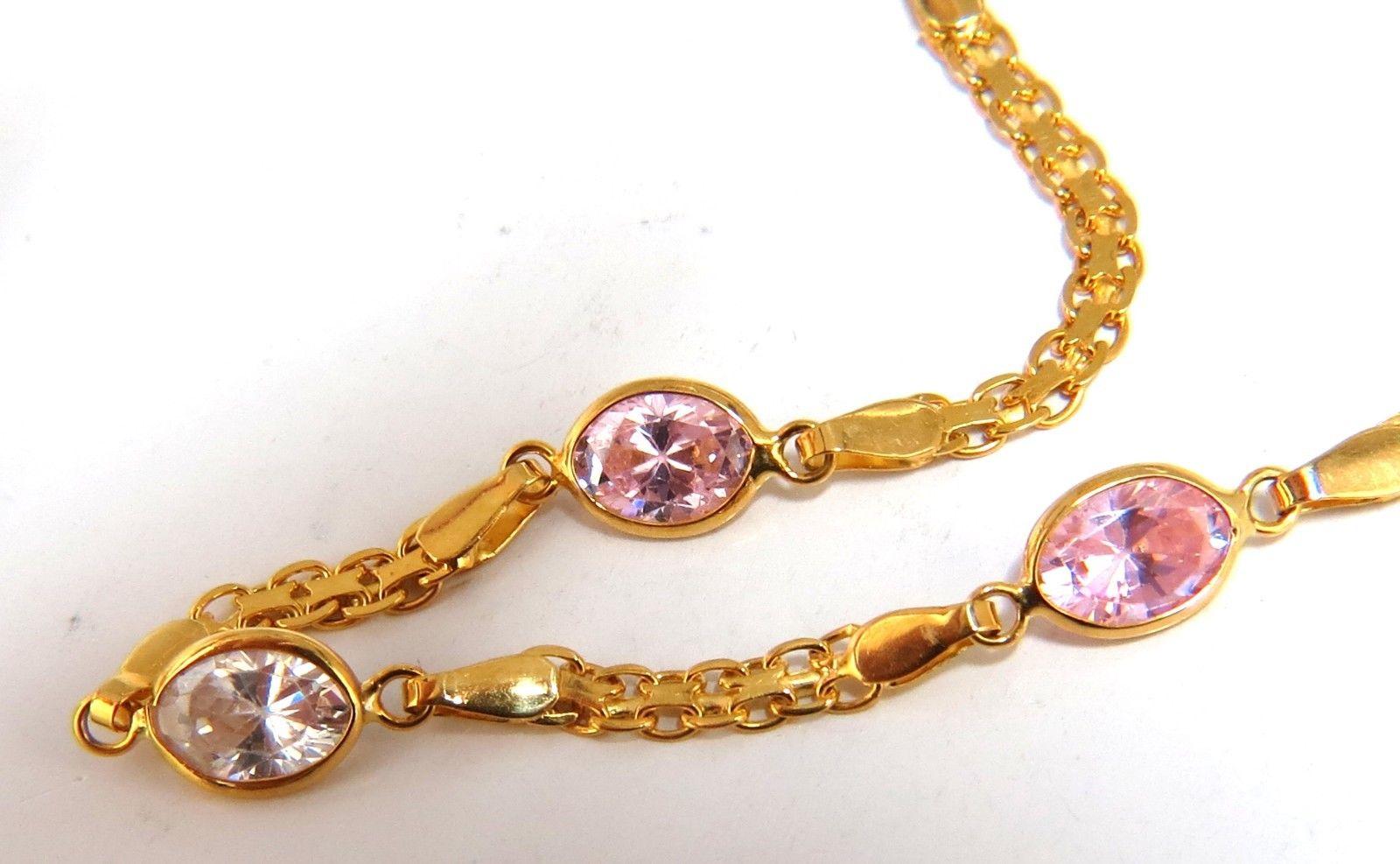 4.50ct Cubic Zircon Pinks & White Bracelet

Secure pressure clasp 

4.8 grams.

14kt. Yellow gold. 

Measures 7 inches (wearable length)

3mm wide Chain