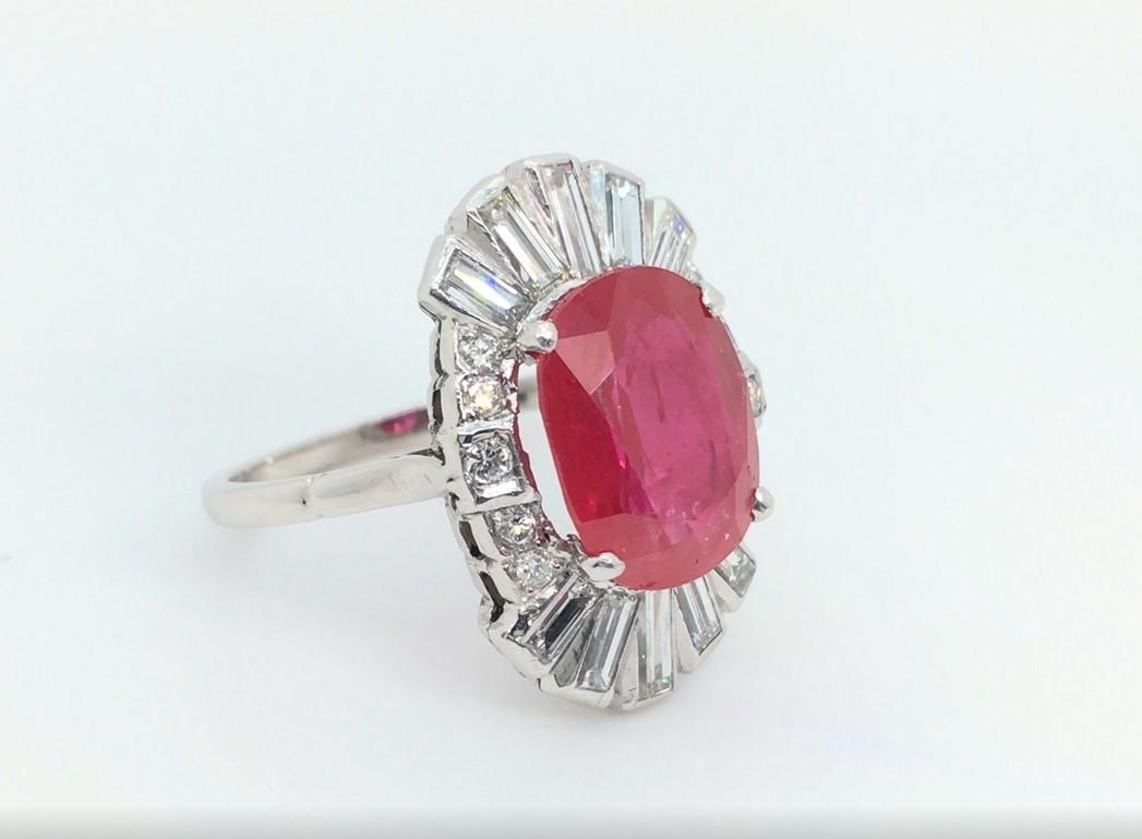 Oval Cut 4.50 Carat Red Ruby and Baguette Diamond Ring For Sale