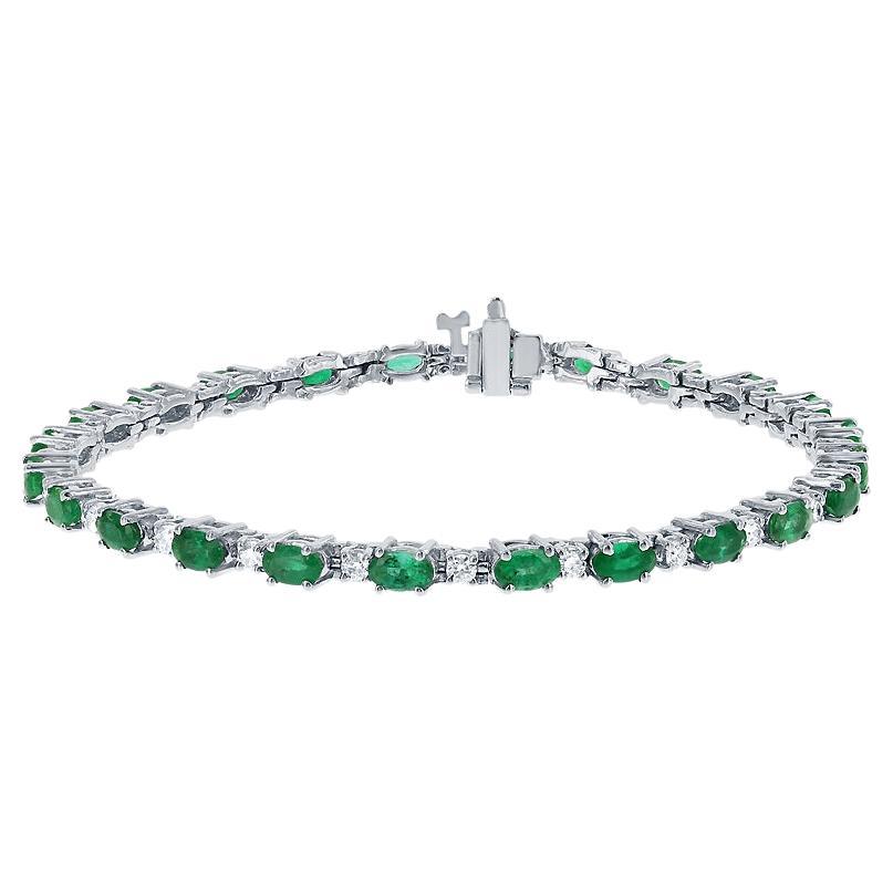 4.50 Carat Total Weight Oval Shaped Emerald & Round Diamond Bracelet For Sale