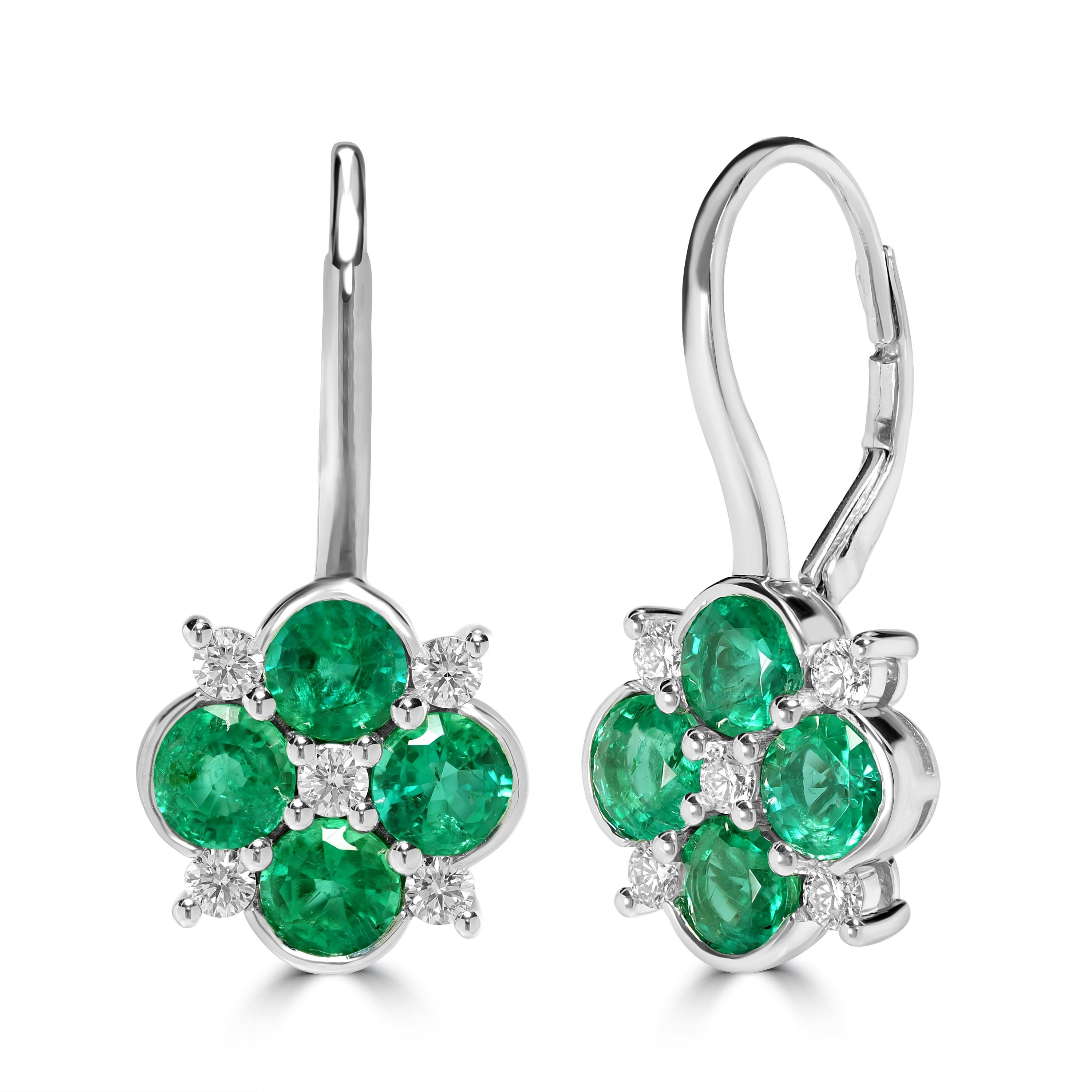This clover leaf dangle earrings are from of emeralds and diamonds set in 18k white gold. The emeralds used are   from Zambia known for their bluish green emerald which are the natures best version of emerald. The diamonds used are of G-H color and