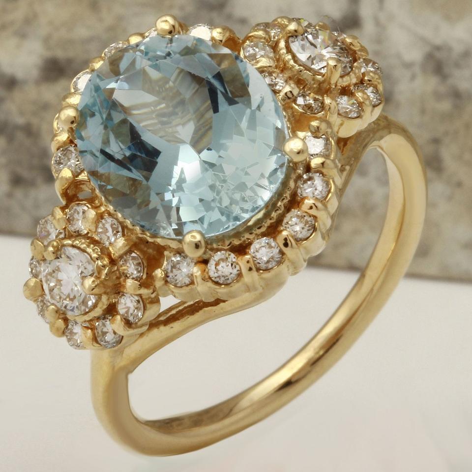 4.50 Carats Exquisite Natural Aquamarine and Diamond 14K Solid Yellow Gold Ring

Total Natural Aquamarine Weight is: 3.50 Carats

Aquamarine Measures: 11.09 x 9mm

Natural Round Diamonds Weight: 1.00 Carats (color G / Clarity VS2-Si1)

Ring size: 7