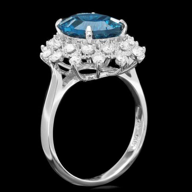 4.50 Carats Natural Blue Topaz and Diamond 14K Solid White Gold Ring

Total Natural Blue Topaz Weight is: Approx. 3.90 Carats 

Blue Topaz Measures: Approx. 11.00 x 9.00mm

Natural Round Diamonds Weight: Approx. 0.60 Carats (color G-H / Clarity