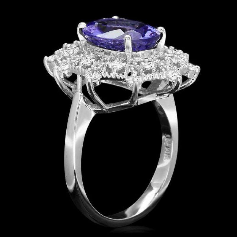 4.50 Carats Natural Very Nice Looking Tanzanite and Diamond 14K Solid White Gold Ring

Total Natural Oval Cut Tanzanite Weight is: Approx. 3.90 Carats 

Tanzanite Measures: Approx. 12.00 x 10.00mm

Natural Round Diamonds Weight: Approx. 0.60 Carats