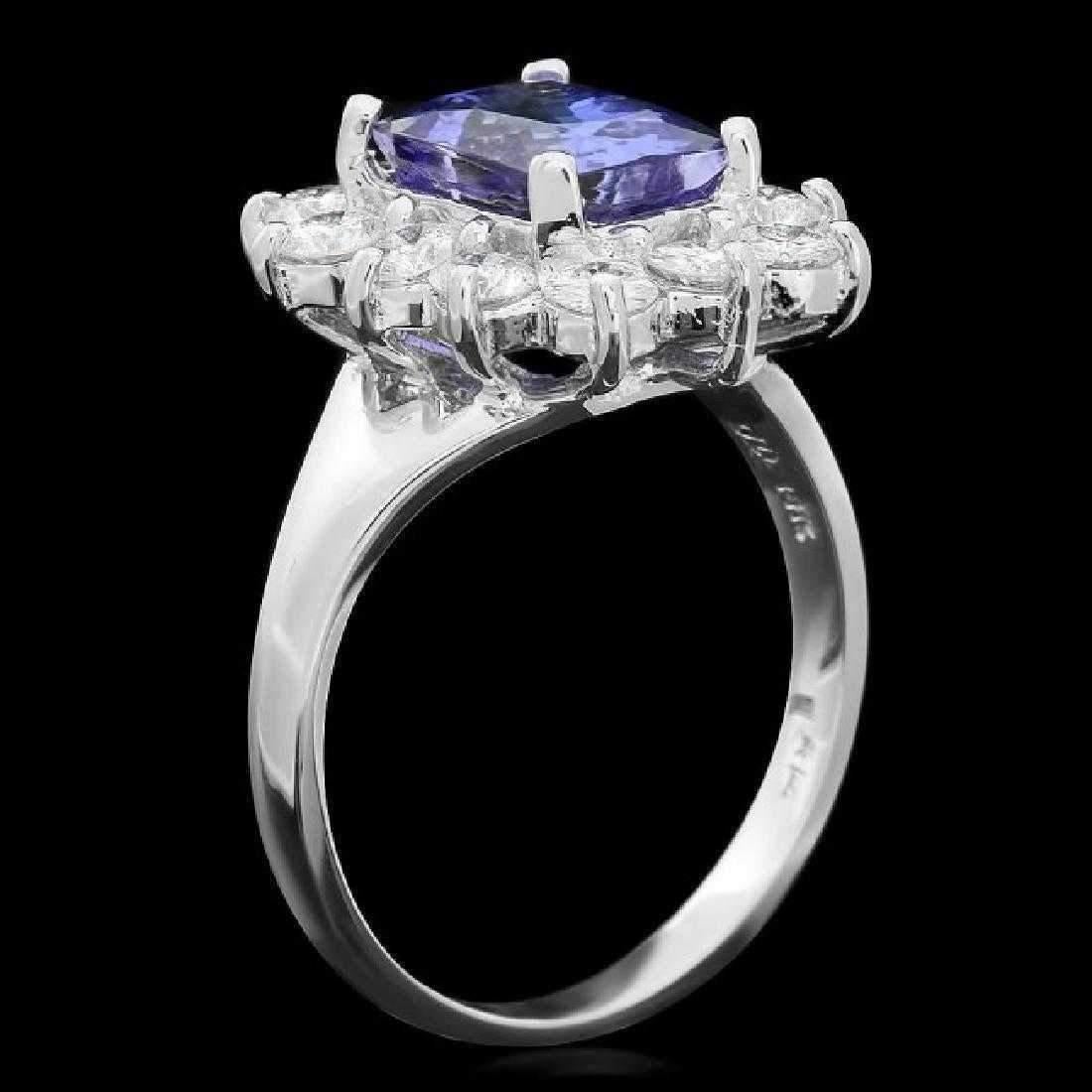 4.50 Carats Natural Very Nice Looking Tanzanite and Diamond 14K Solid White Gold Ring

Total Natural Cushion Cut Tanzanite Weight is: Approx. 3.50 Carats

Tanzanite Measures: Approx. 9.00 x 7.00mm

Natural Round Diamonds Weight: Approx. 1.00 Carats