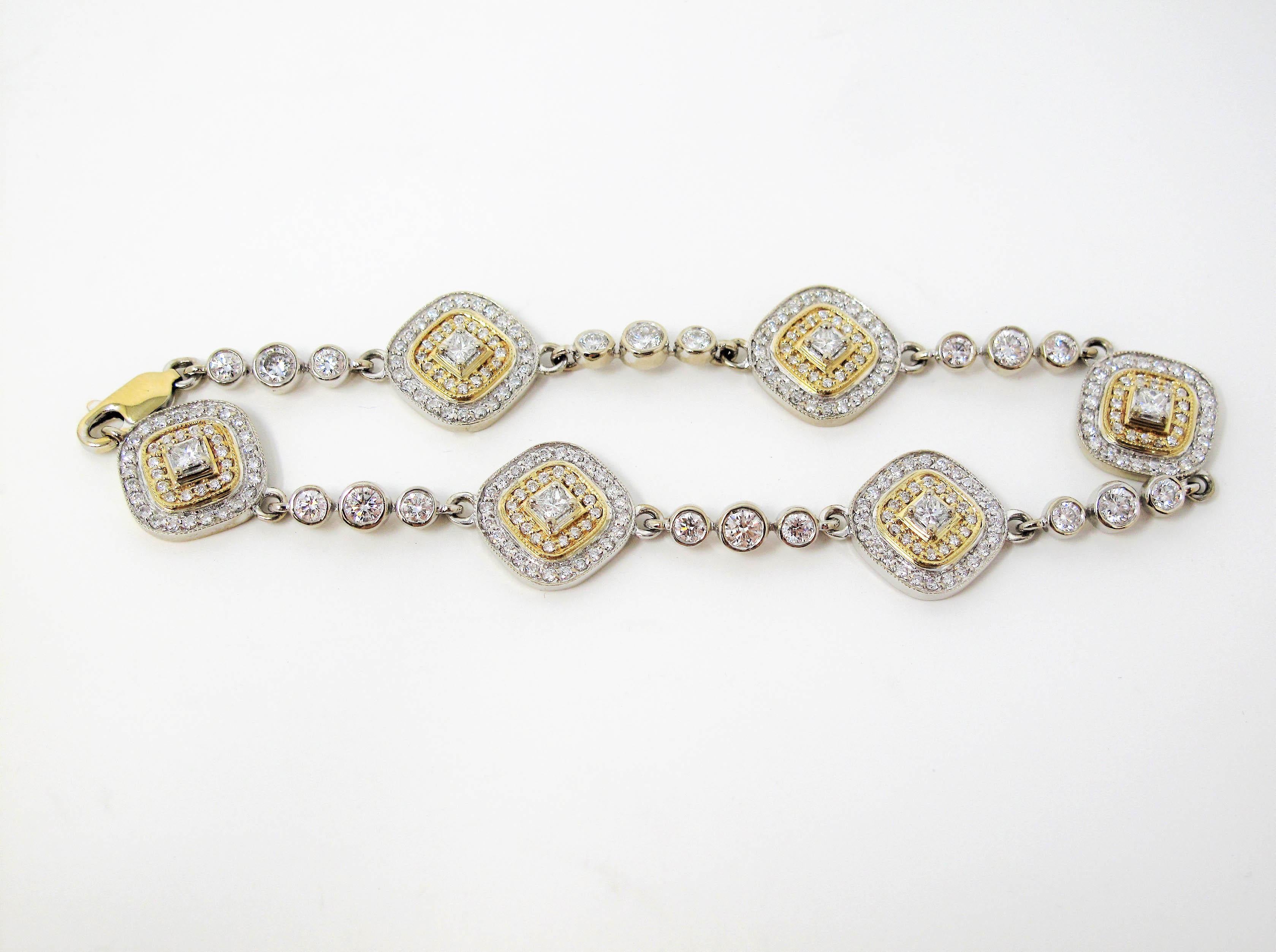 This incredible glittering two-tone station bracelet boasts an ultra feminine, modern design with serious sparkle. The dazzling bracelet sits delicately on the wrist and offers an understated elegance with its unique double pave diamond halo station