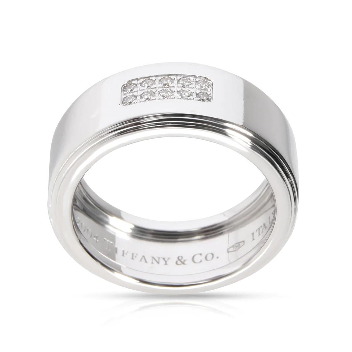 NEW with Tags, Tag price $4500

TIFFANY & CO BAND, Century Collection, stamped © Tiffany & Co.    750   ITALY

High quality White Diamond, 0.1 CT

The ring is size 9 US size and can be re-sized by your local jeweler.

18K White gold, stamped