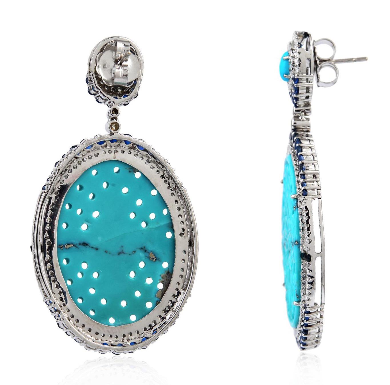 Cast from 18-karat gold and sterling silver.  These earrings are set in 45.05 carats turquoise, 4.41 carats blue sapphire and 2.17-carats of diamonds.

FOLLOW  MEGHNA JEWELS storefront to view the latest collection & exclusive pieces.  Meghna Jewels