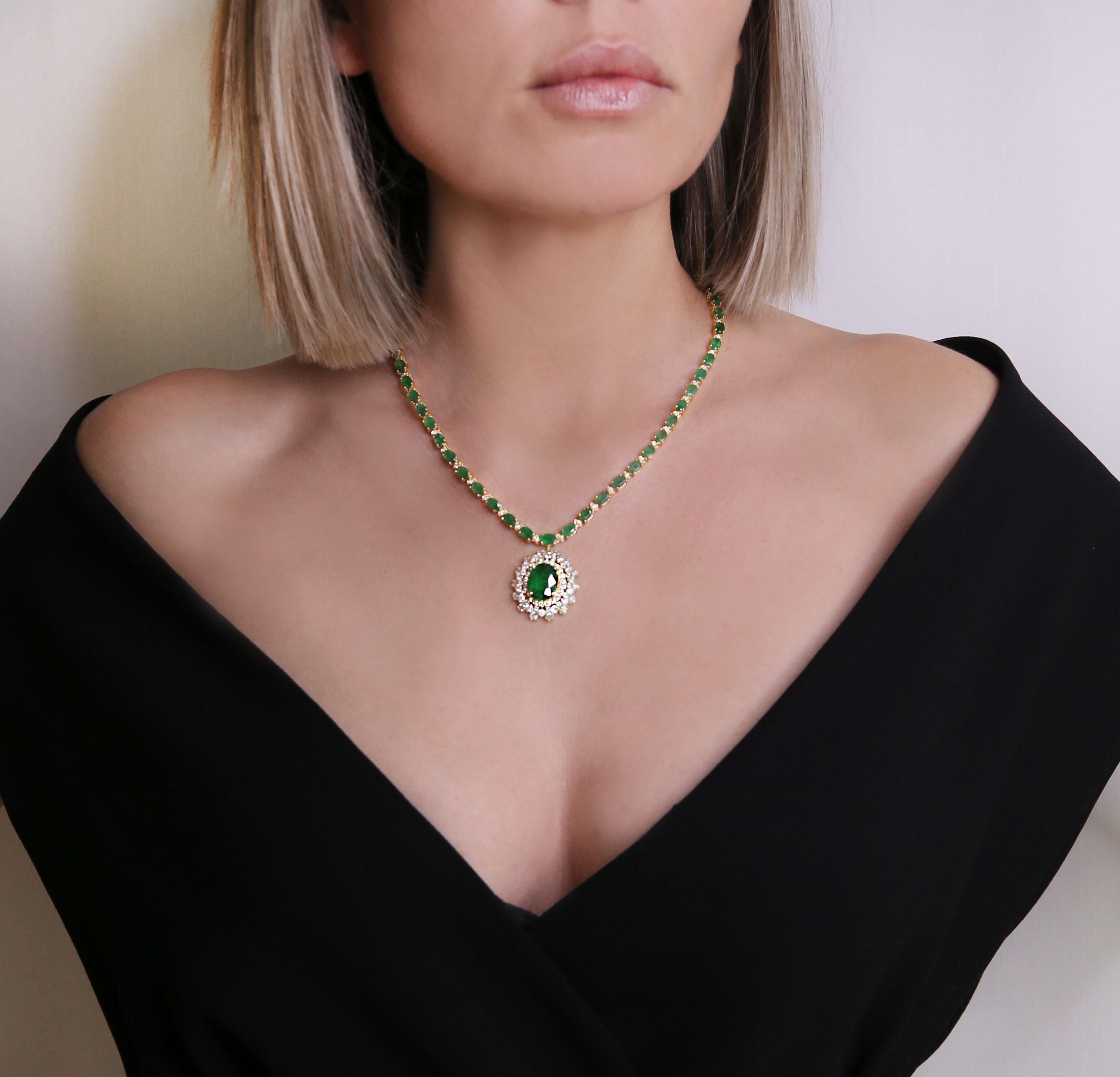 45.07 CTW Emerald 18K Yellow Gold Diamond Necklace

Stamped: 18K
Total Necklace Weight: 36 Grams
Necklace Length: 18 Inches
Center Emerald Weight: 6.61 Carat (14.60x11.10 Millimeters)
Side Emerald Weight 40.10 Carat (7.00x5.00 Millimeters)
Diamond