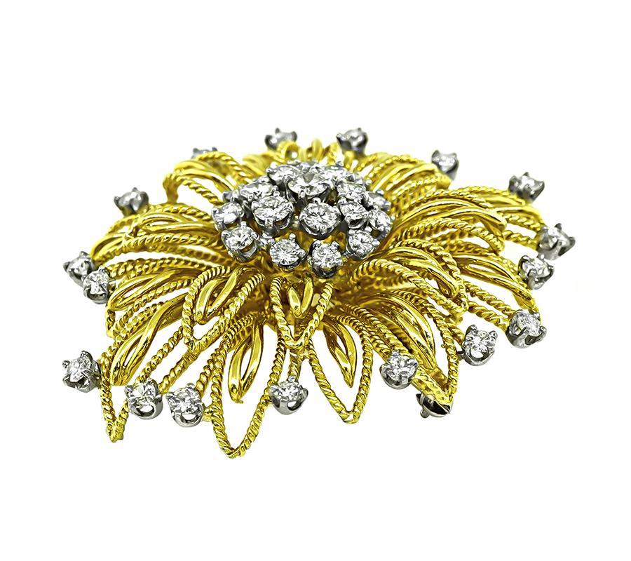 This is an amazing 18k yellow gold and platinum pin. The pin is set with sparkling round cut diamonds that weigh approximately 4.50ct. The color of these diamonds is F with VS clarity. The pin measures 51.5mm by 42mm and weighs 25.6 grams. The pin